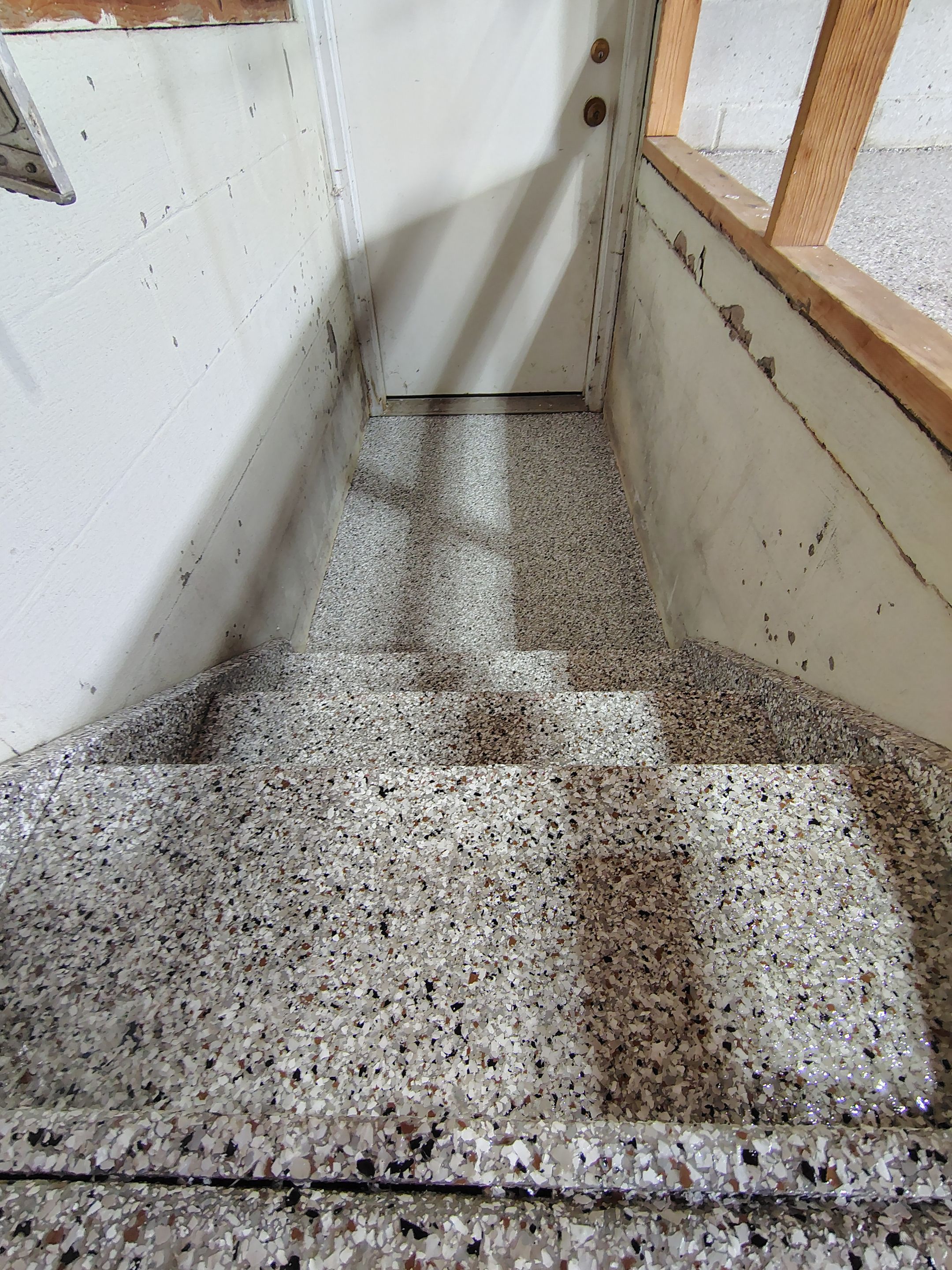 Sioux Falls Garage Epoxy Floor Installation and Concrete Crack Repair by Select Painting, Coatings & Garage Cabinets