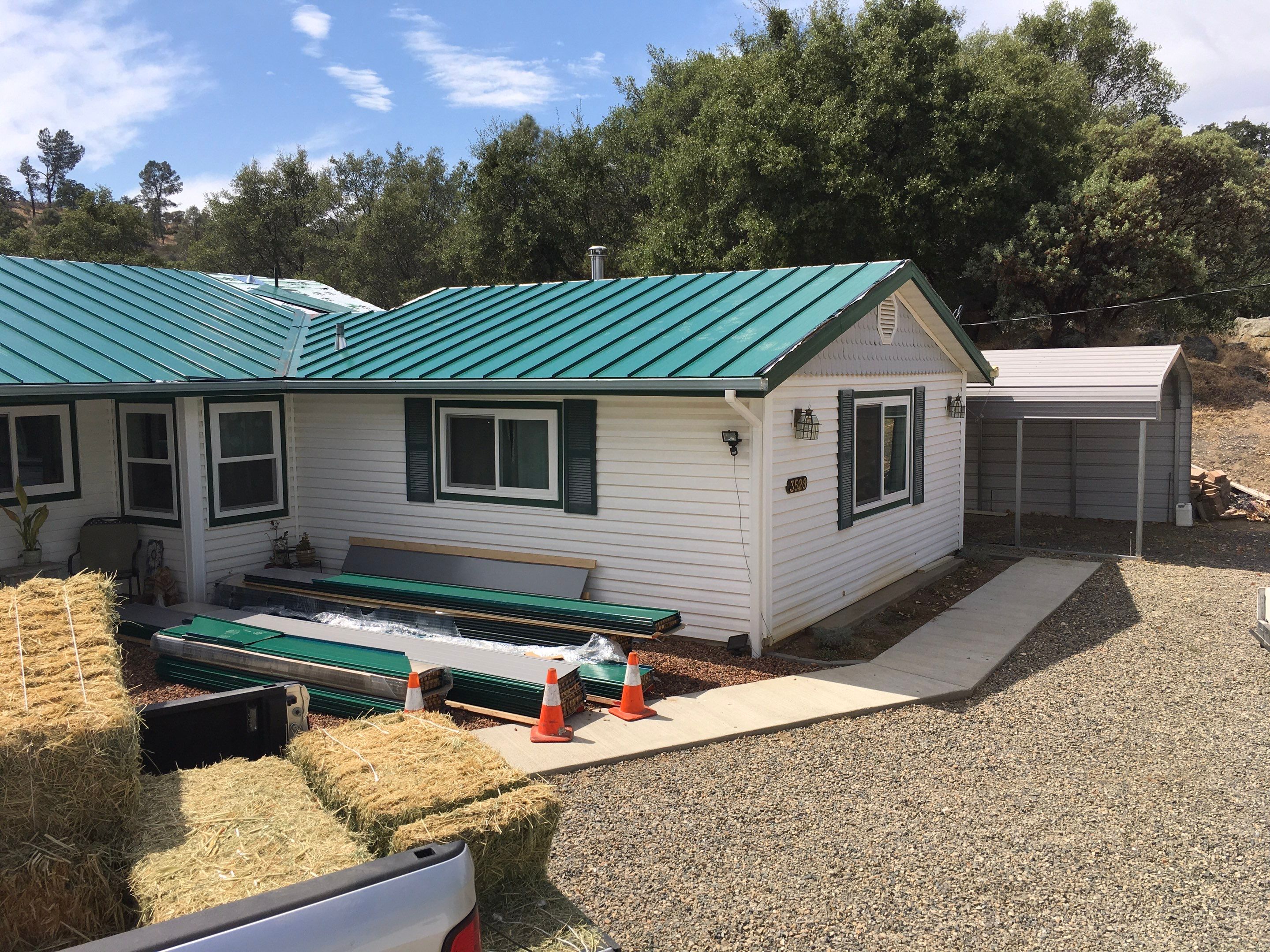 Metal roofing installation using Standing seam metal roofing system by Straight Edge Roofing Inc
