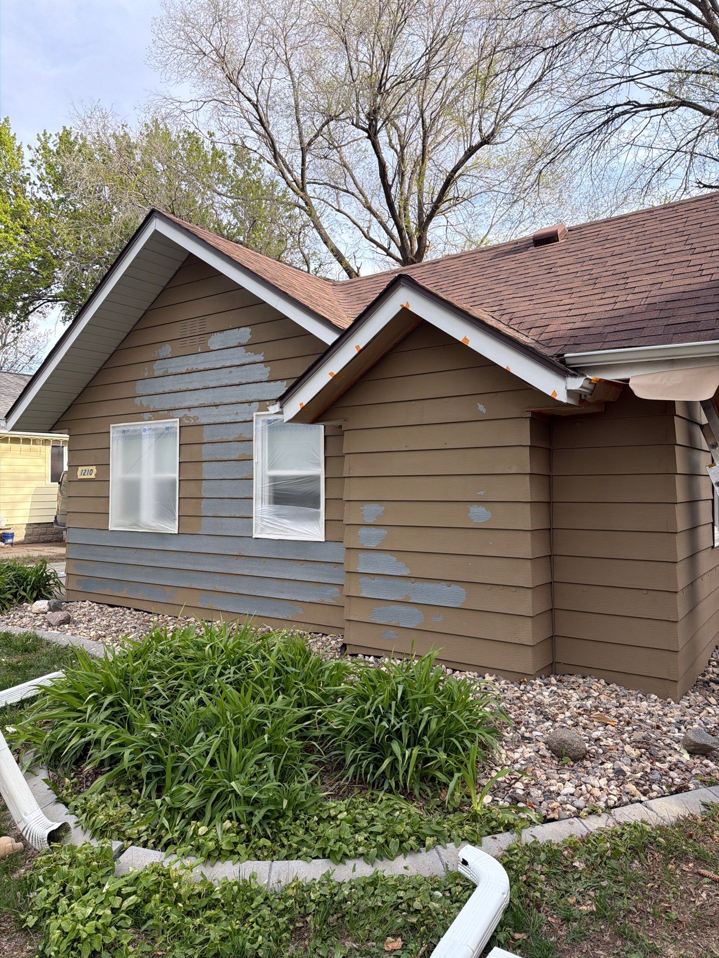 Exterior Siding Repair and Full House Repaint in Sioux Falls by Select Painting, Coatings & Garage Cabinets