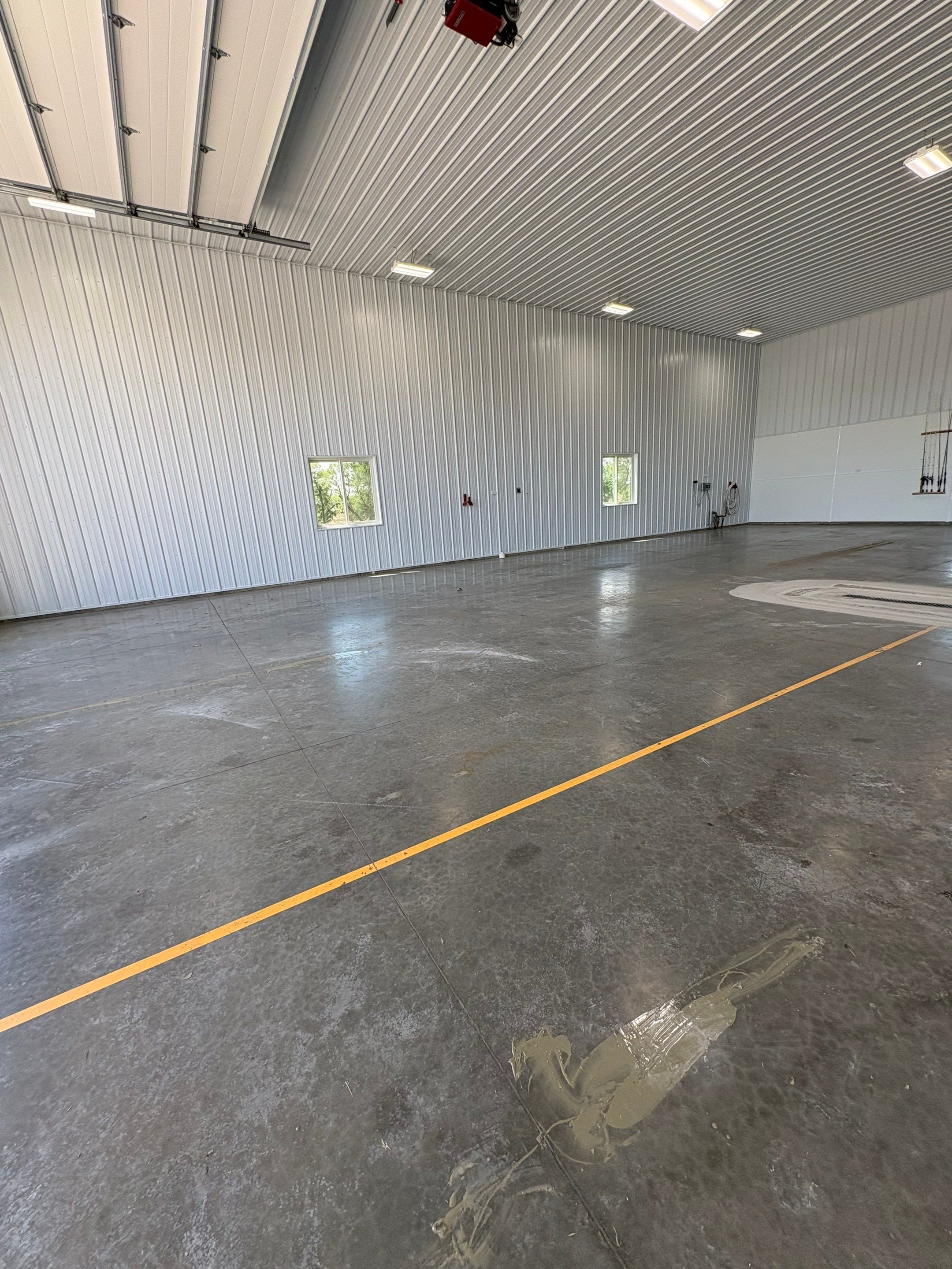 Multi-Stage Concrete Floor Coating for Egan Shop and RV Storage by Select Painting, Coatings & Garage Cabinets