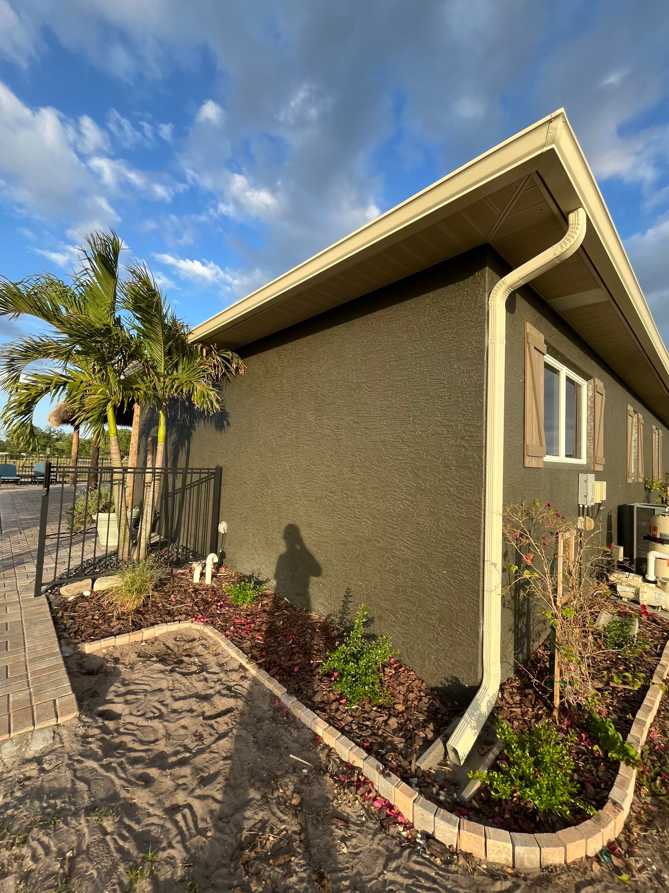  7-inch White seamless gutters and downspouts in Myakka City FL by Gutter Professors