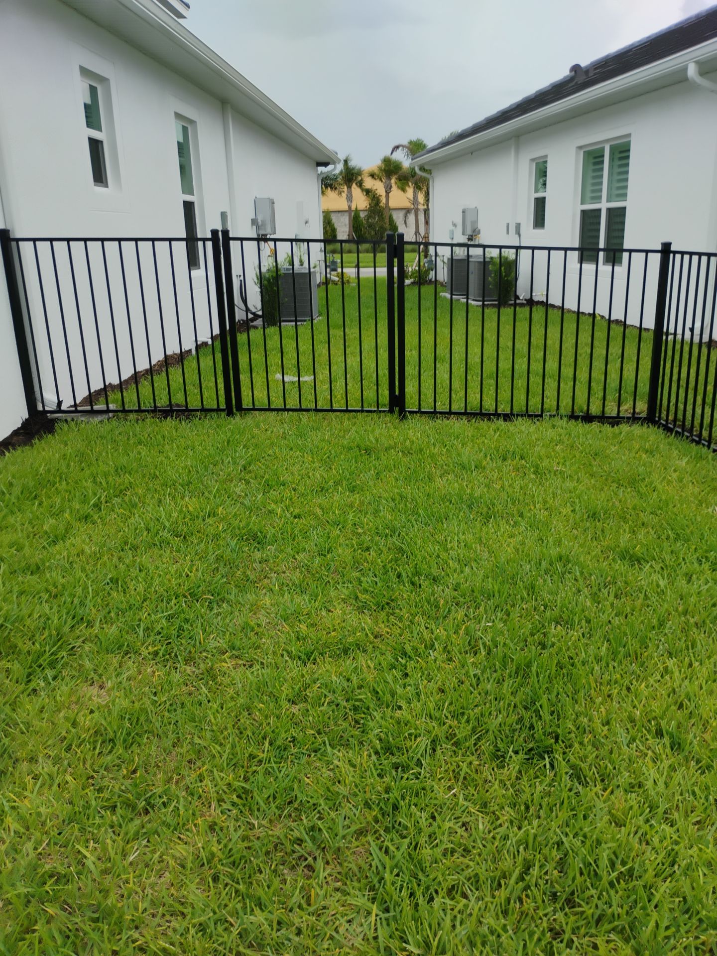 Black Aluminum Picket Fence Installation in Venice, Florida by True Fence LLC