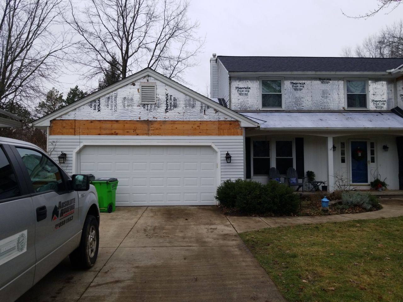 James Hardie Siding  using James Hardie Board and Batten, White by Absolute Roofing and Construction