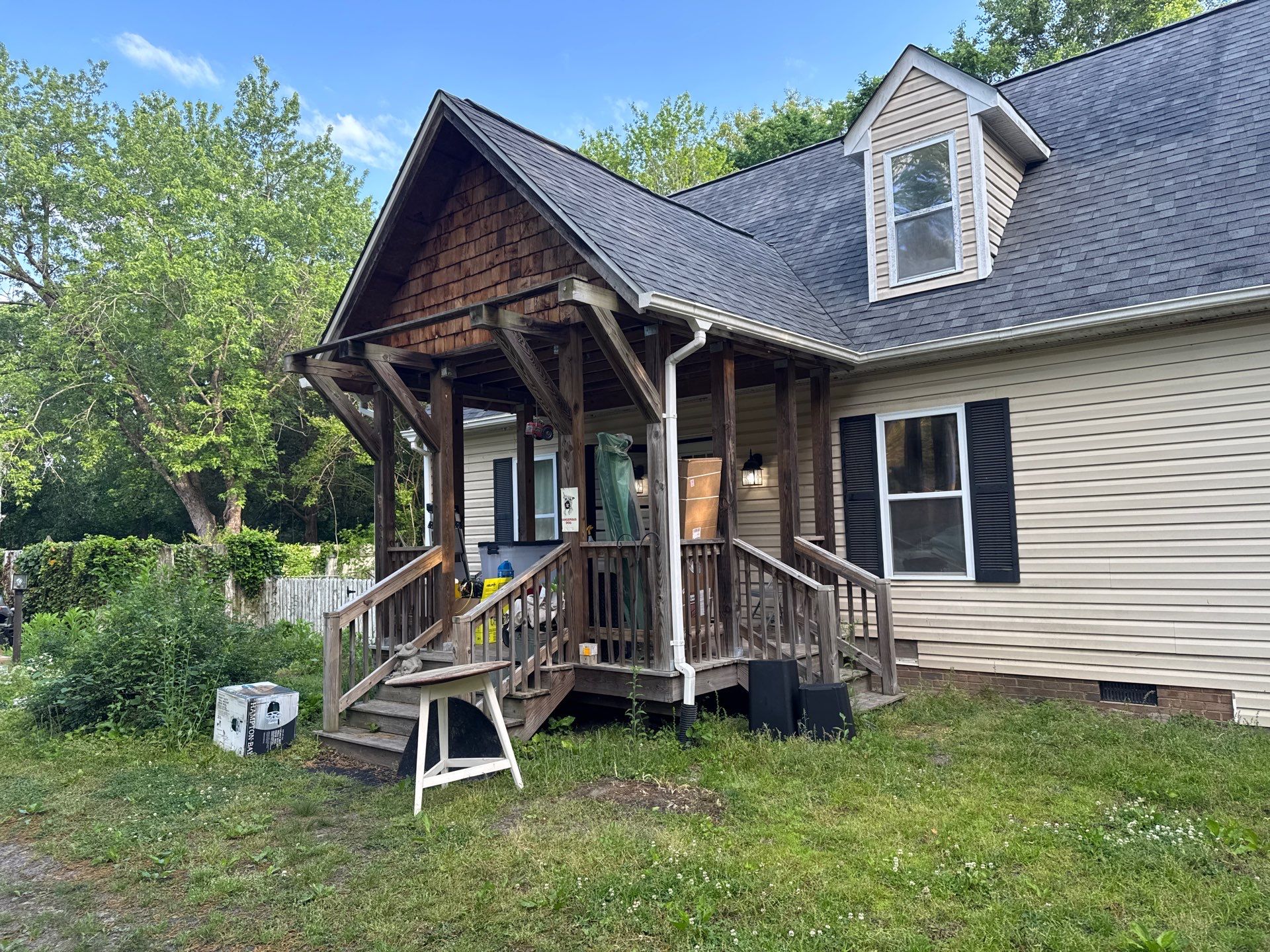 Gloucester Exterior Overhaul with Navy Blue Siding and New Roof by Cade Construction