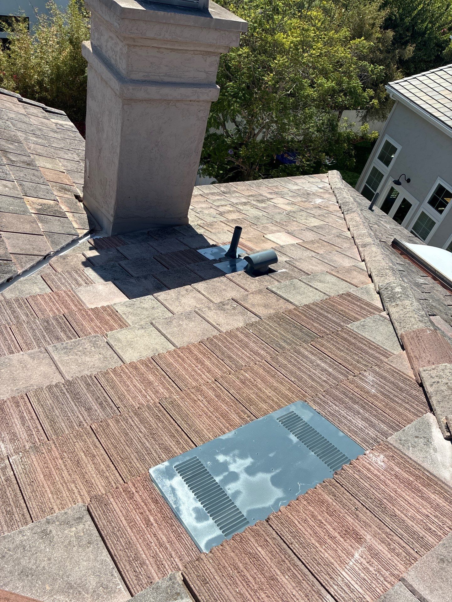 Carlsbad Concrete Tile Roof Replacement with Copper Flashing and Skylights by Reliable Roofing San Diego Inc.