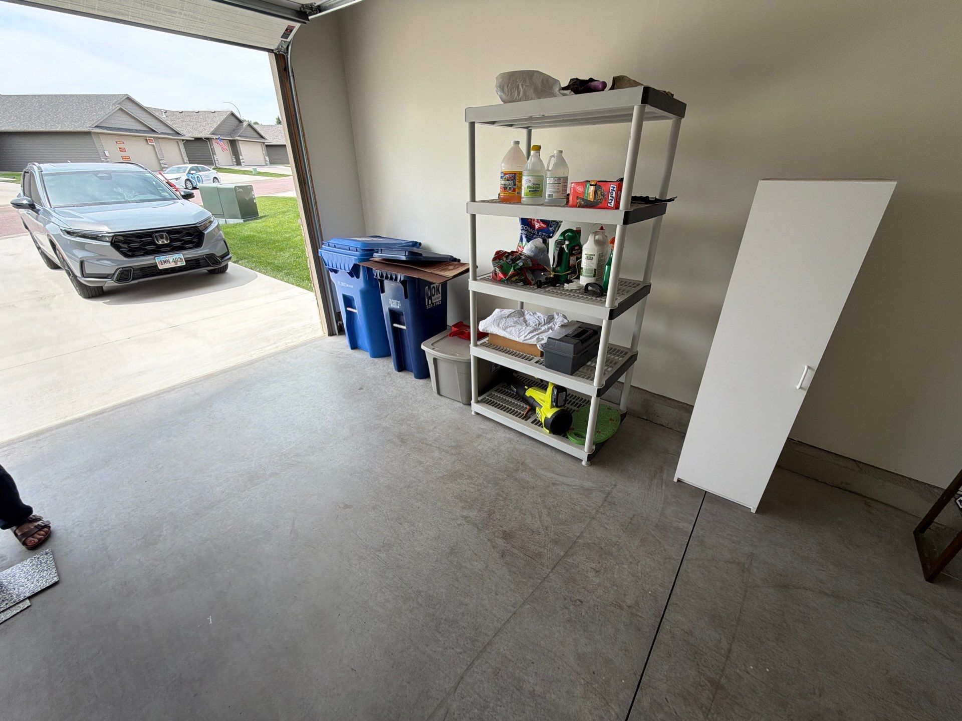 Cabin Fever Garage Floor Coating in Sioux Falls by Select Painting, Coatings & Garage Cabinets