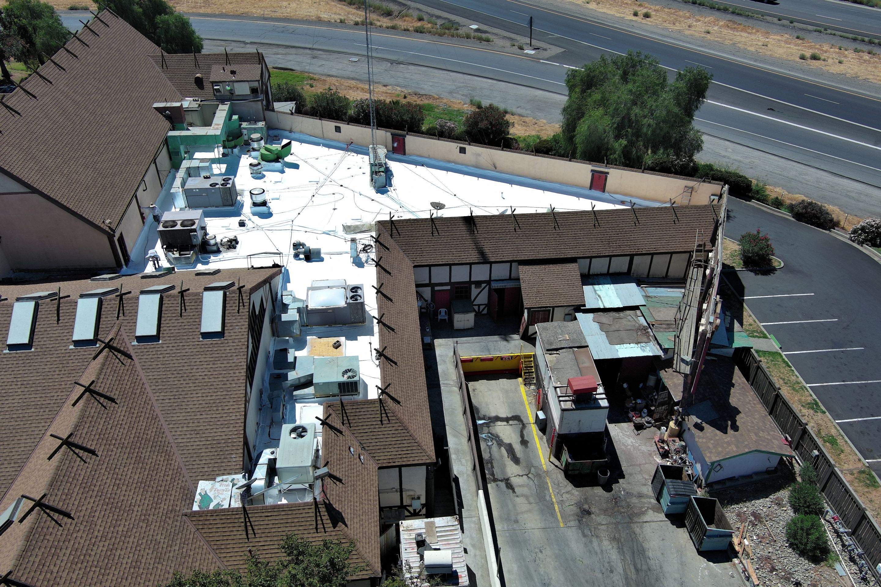 Spray foam and coatings using General Coatings acrylic coatings and spray foam by Straight Edge Roofing Inc