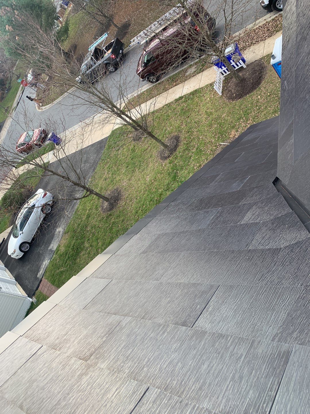 Tesla Solar Roof and Gutter Installation by American Home Contractors