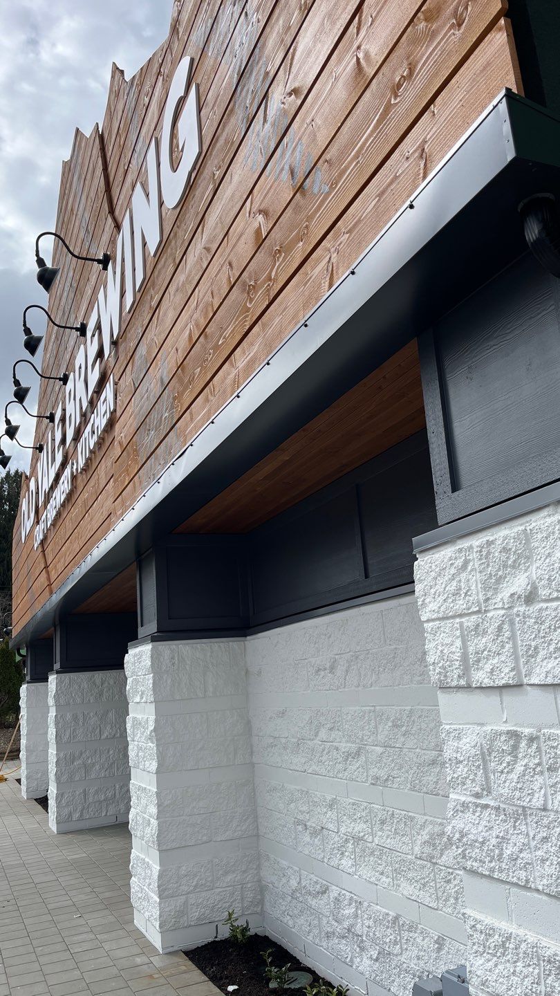 Commercial Roofing Installation using 12" Prolok metal and hidden gutters! by Top Notch Roofing Inc