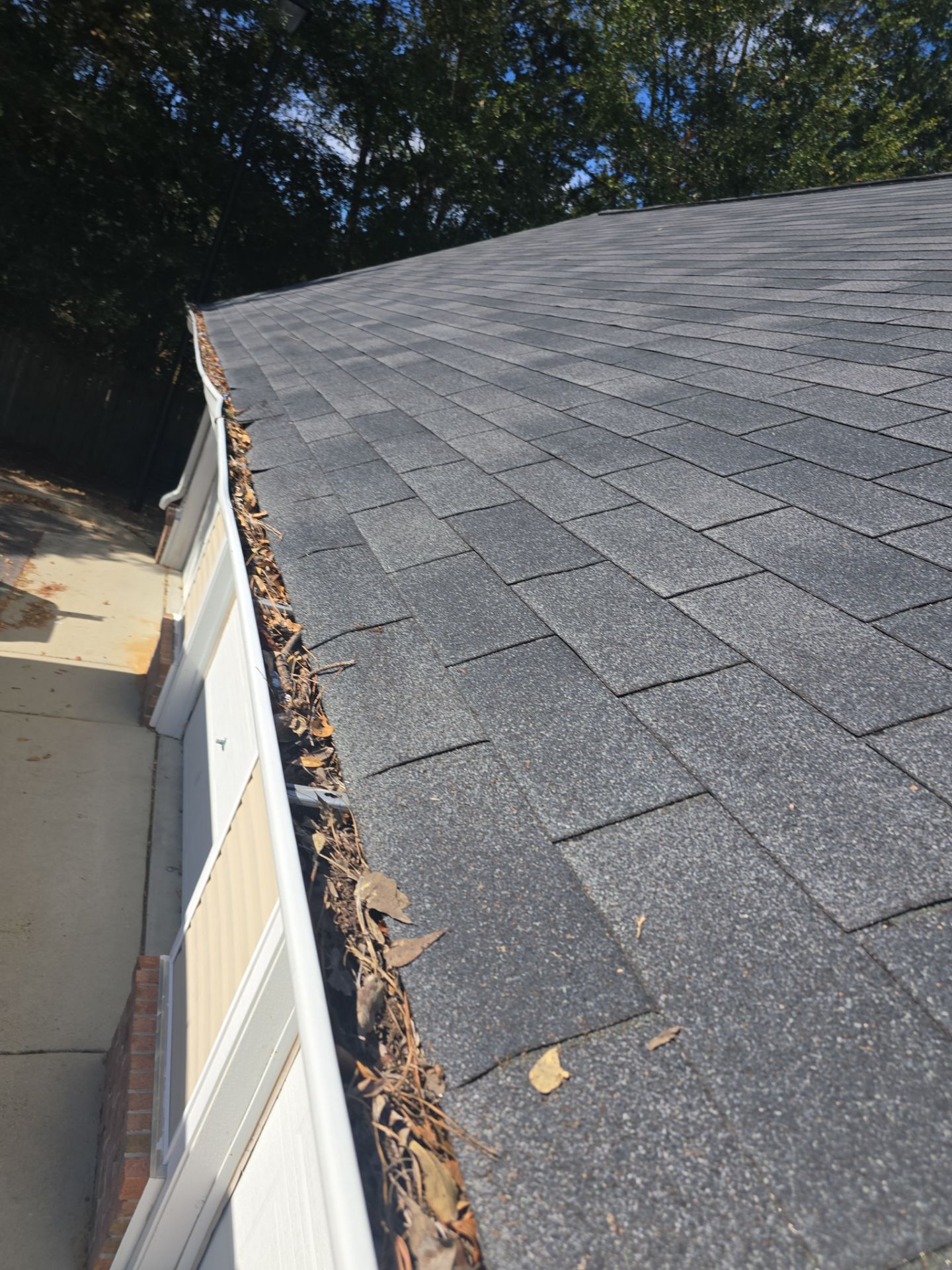 Commercial gutter cleaning Sandhills & Aberdeen, NC before photo with filled gutters