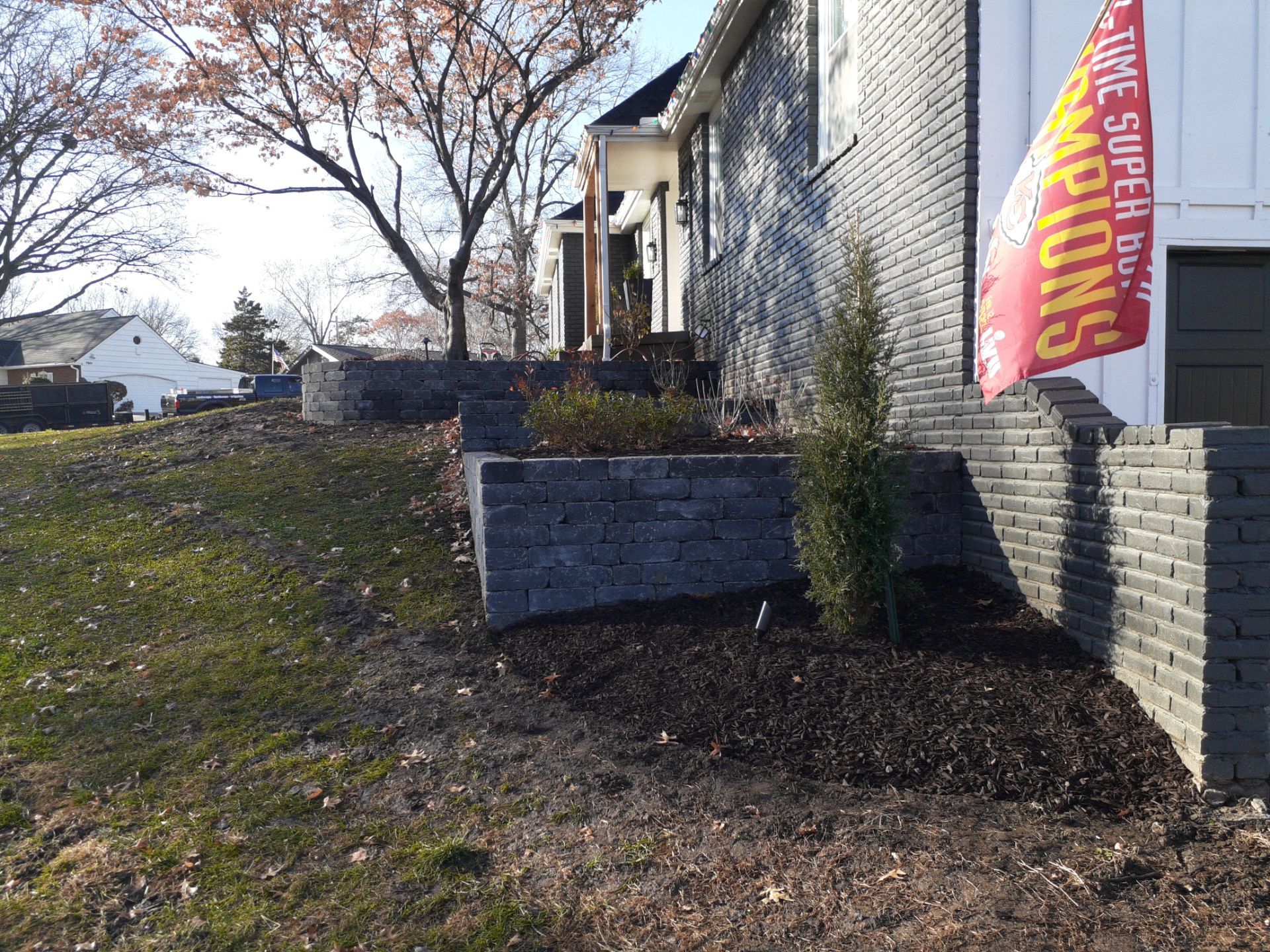 Entire Home Landscape and Retaining Walls by LAND ESCAPES LLC