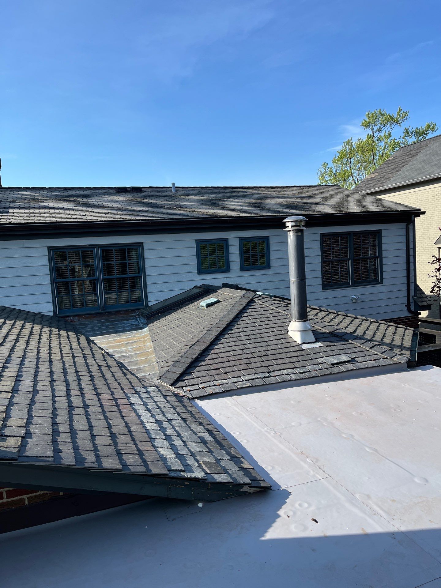 Arlington: Buckingham Slate and Carlisle Syntec TPO Roof by RM Banning, Inc.