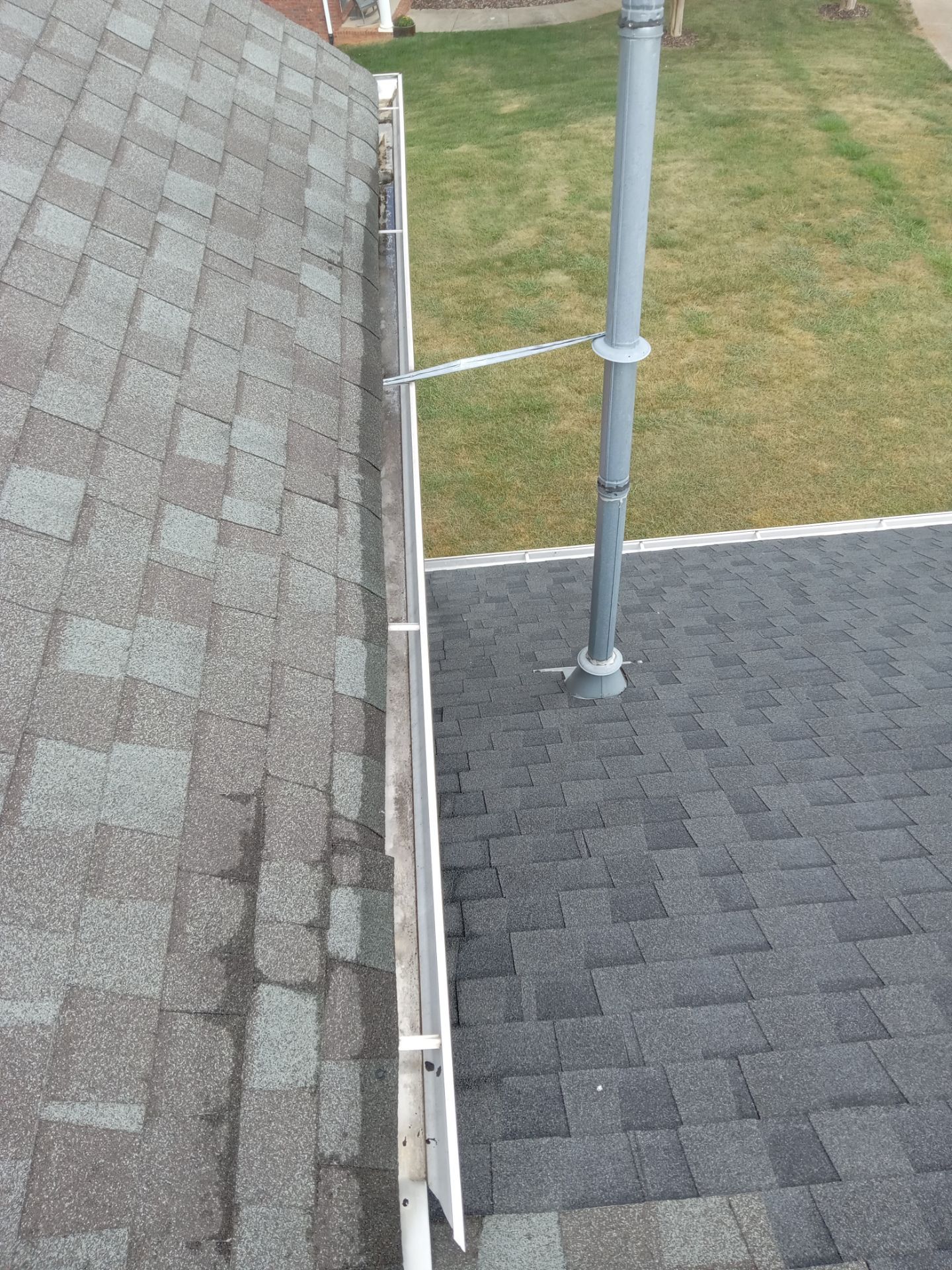 pressure washing roof cleaning removing algae stains restoring shingle appearance improving curb appeal