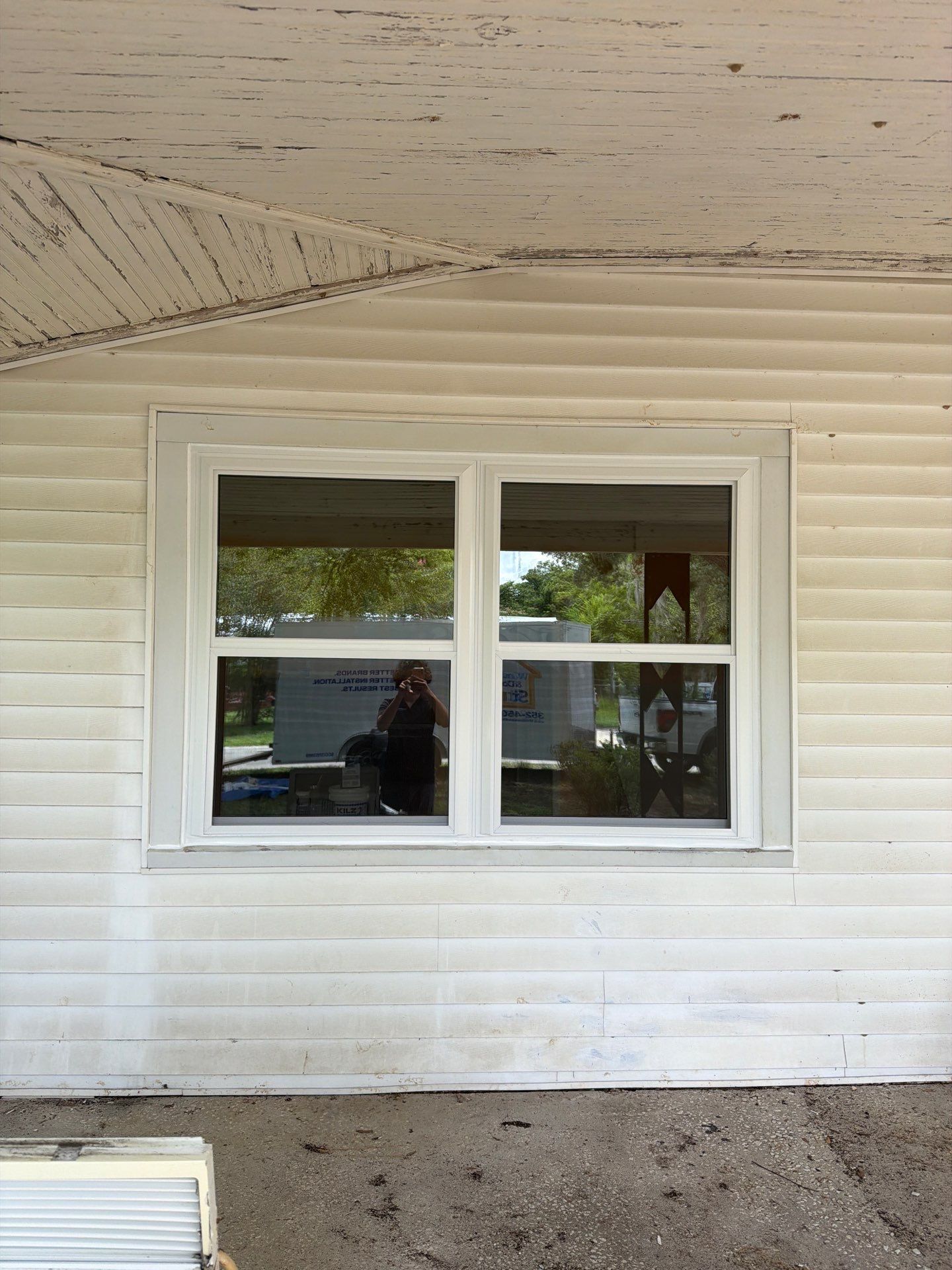 White Vinyl Window Replacement for Residential Home in Williston by Windows & Doors Store