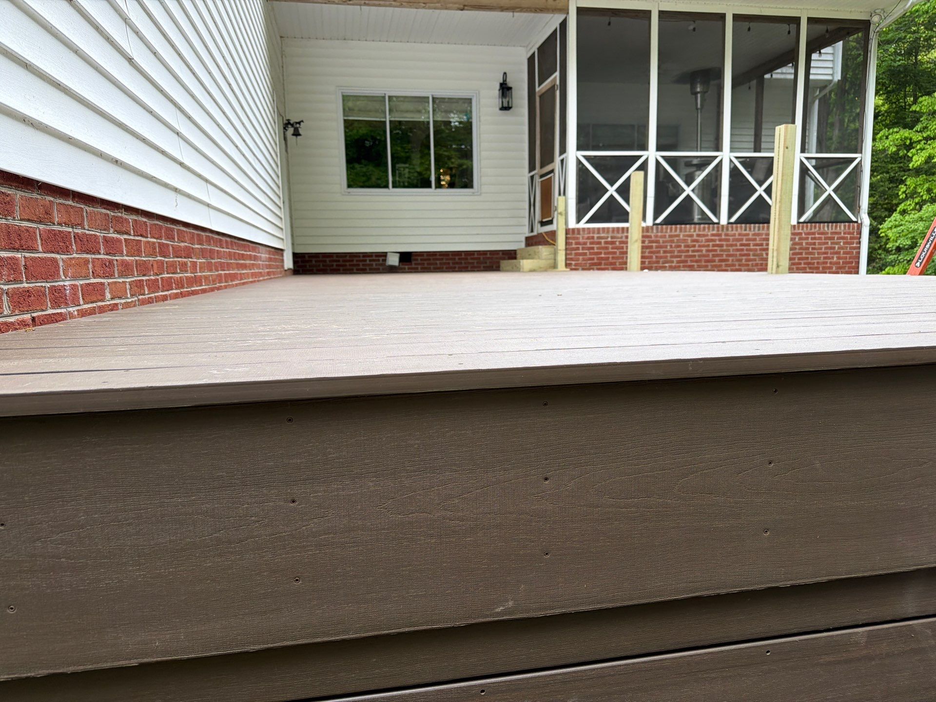 Custom Composite Deck and White Vinyl Railing Installation in Fayetteville by Walnut Hollow Decks & Outdoor Living