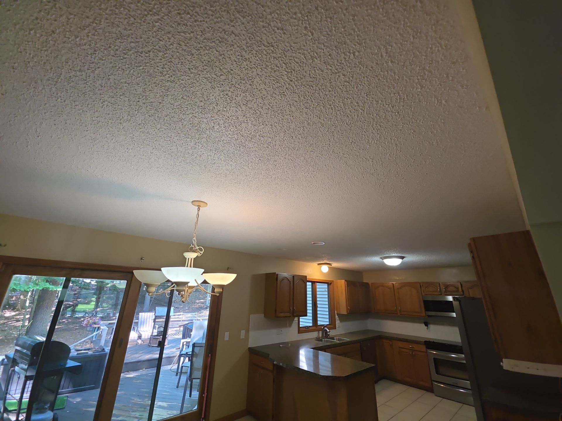 Norton Shores Kitchen Cabinet Painting and Deck Restoration Project by Gordon Painting