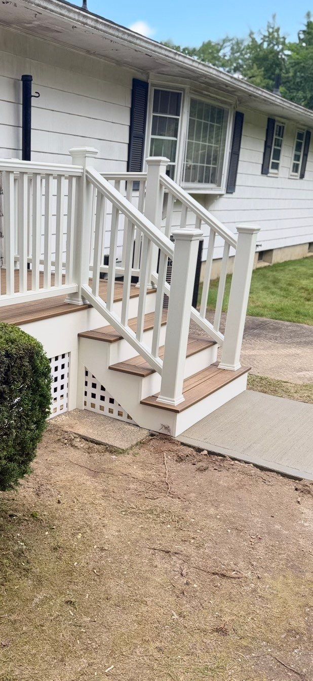 Deck Replacement using Trex Tropical Havana Gold and Transcend White Railings and white lattice by DiGiorgi Roofing and Siding Inc