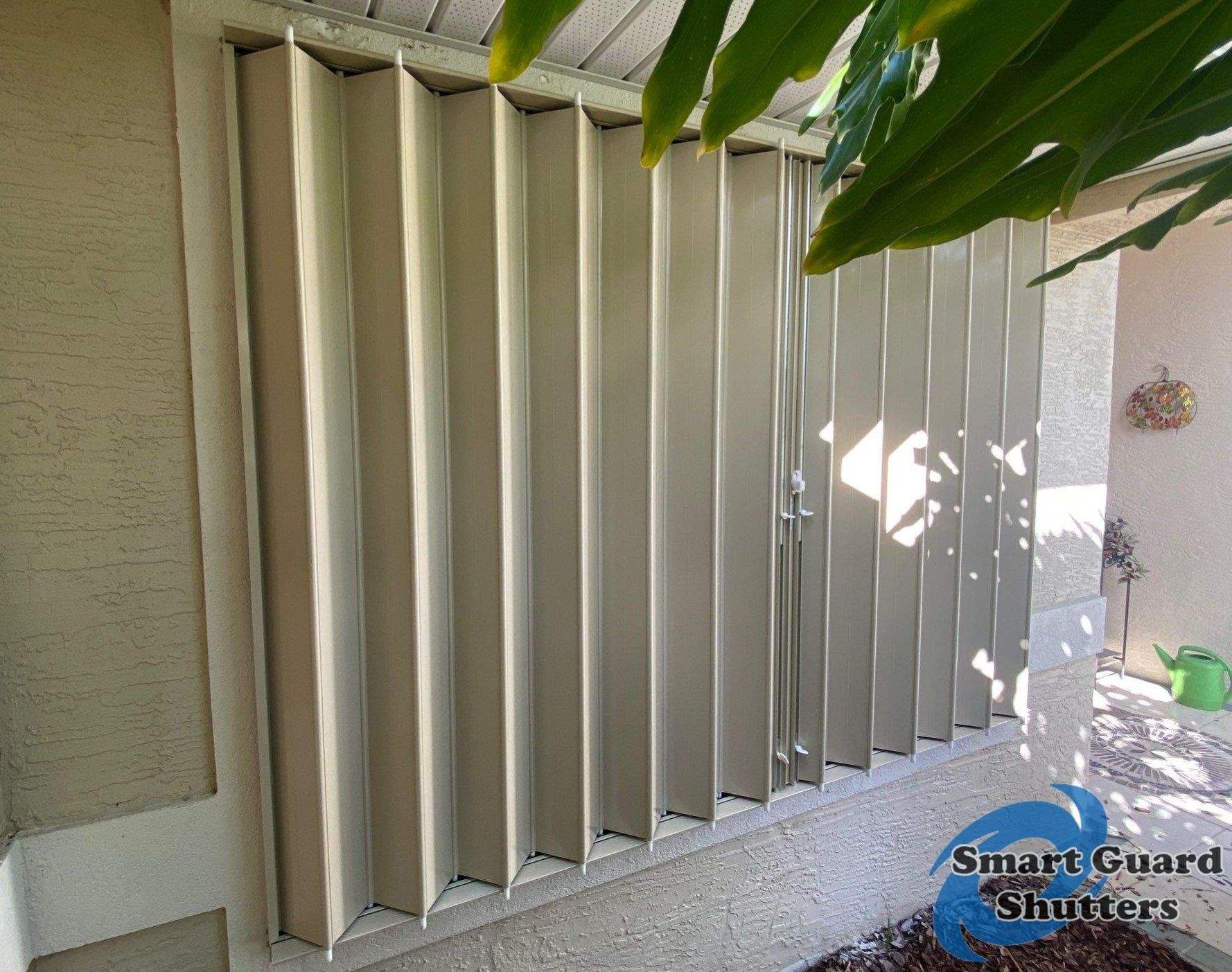 Accordion Shutters in Beige by Smart Guard Shutters