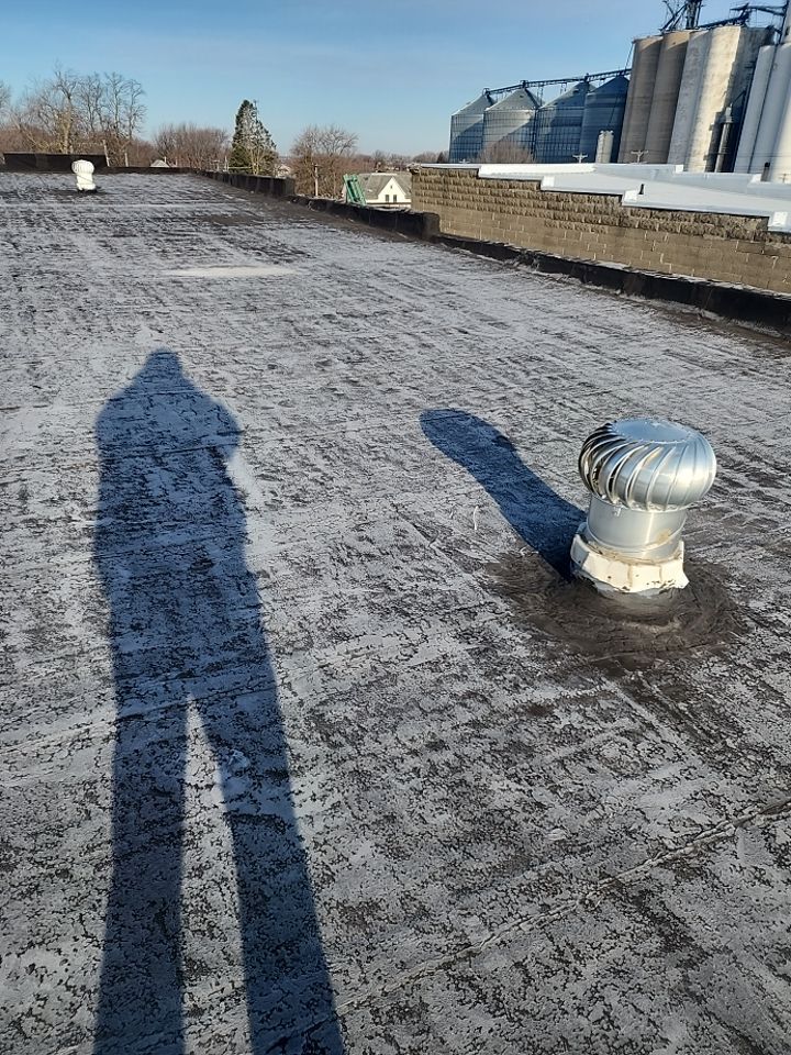 Recover of a downtown building  by Grell Roofing, LLC