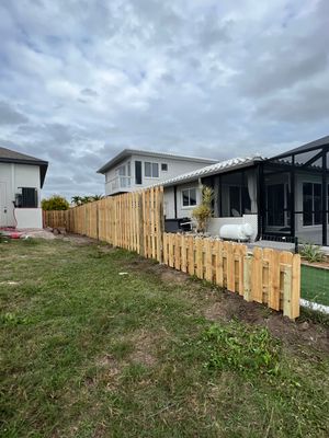 Wood Fence Installation using 6Ft Tall Pressure Treated Wood Shadowbox Fence