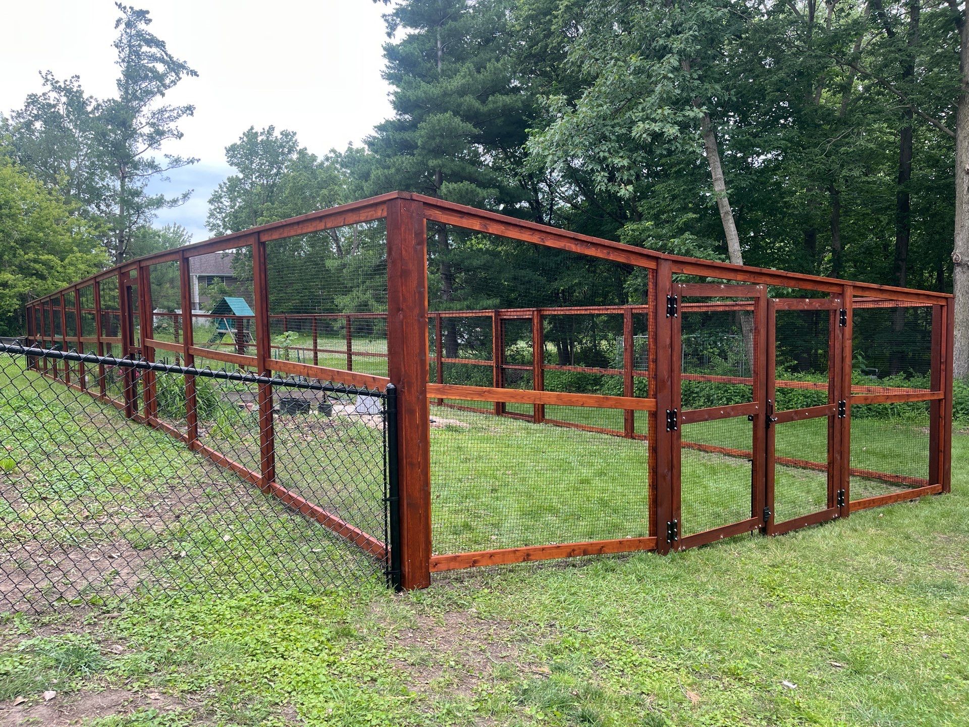 Stained Cedar Mahogany Garden Fence and Raised Bed Enclosure in Cedar Falls by Perfect Picket Fence and Stain