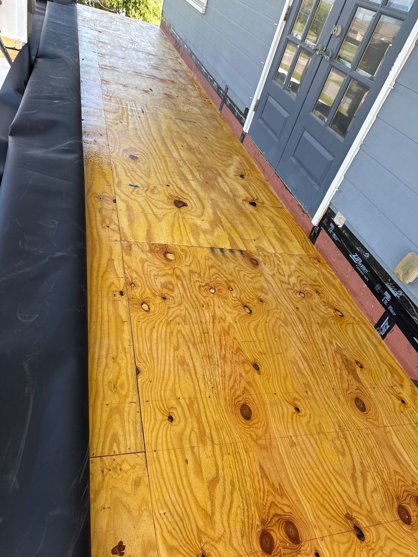 Walk Out Patio Cover by Bayfront Roofing and Construction