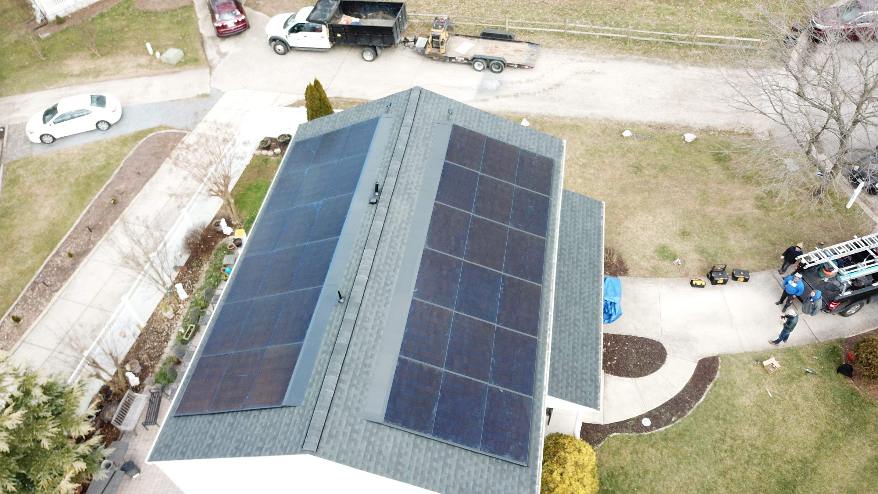 Roof Replacement with GAF Decotech integrated solar panels by American Home Contractors