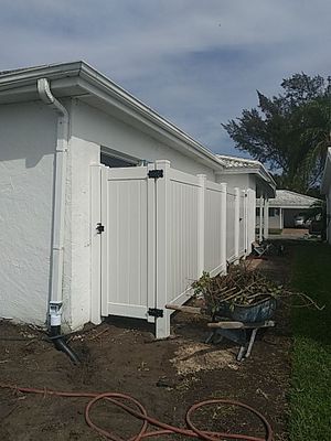 Vinyl privacy fence installation used as a shower enclosure. 