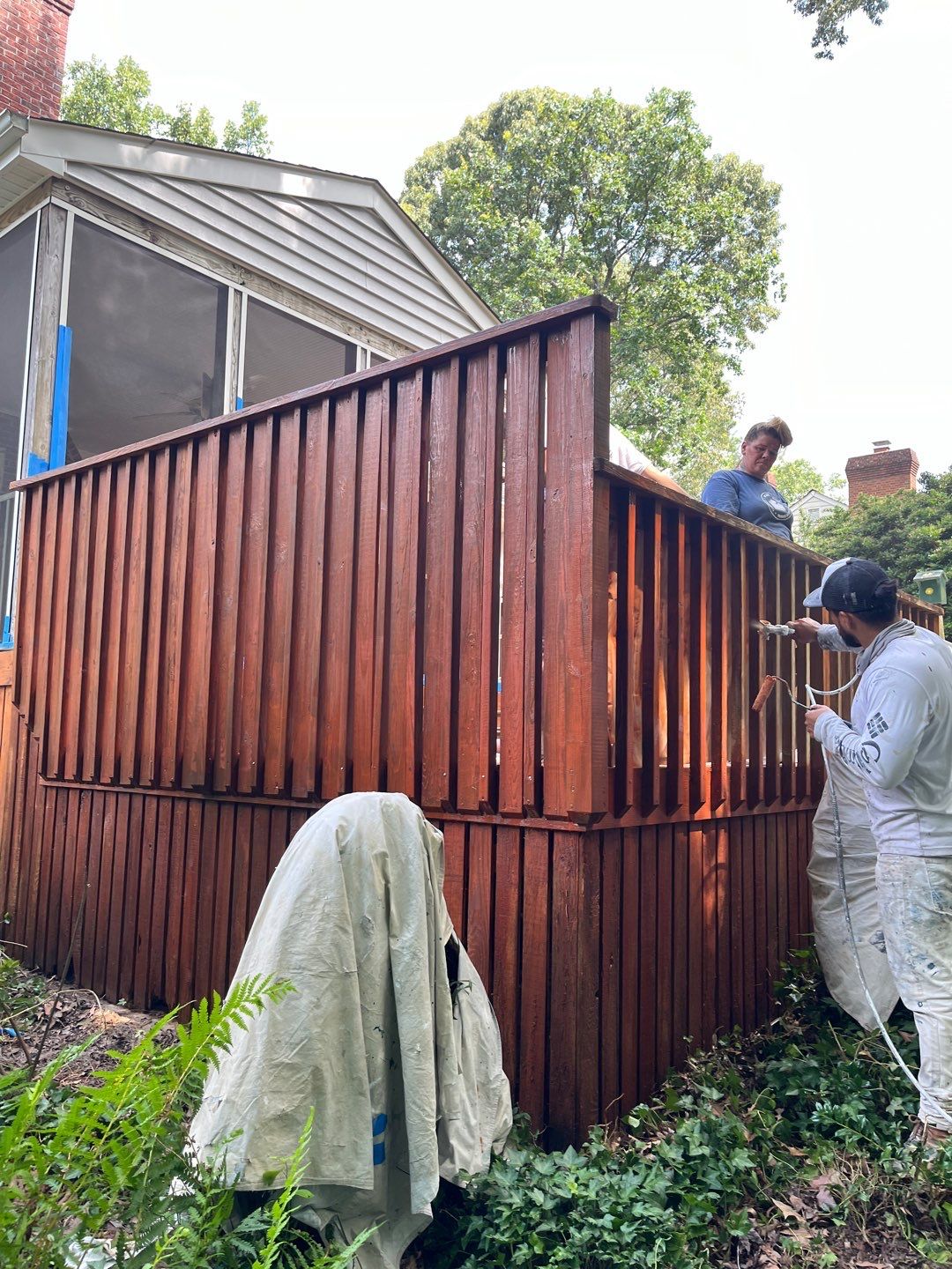 Triple deck re-staining by AKK Painting LLC