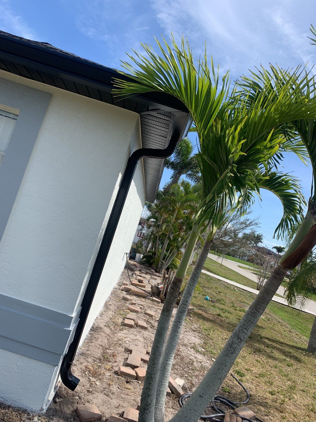 Black Seamless Gutters for Modern Cape Coral Homes by Gutter Professors
