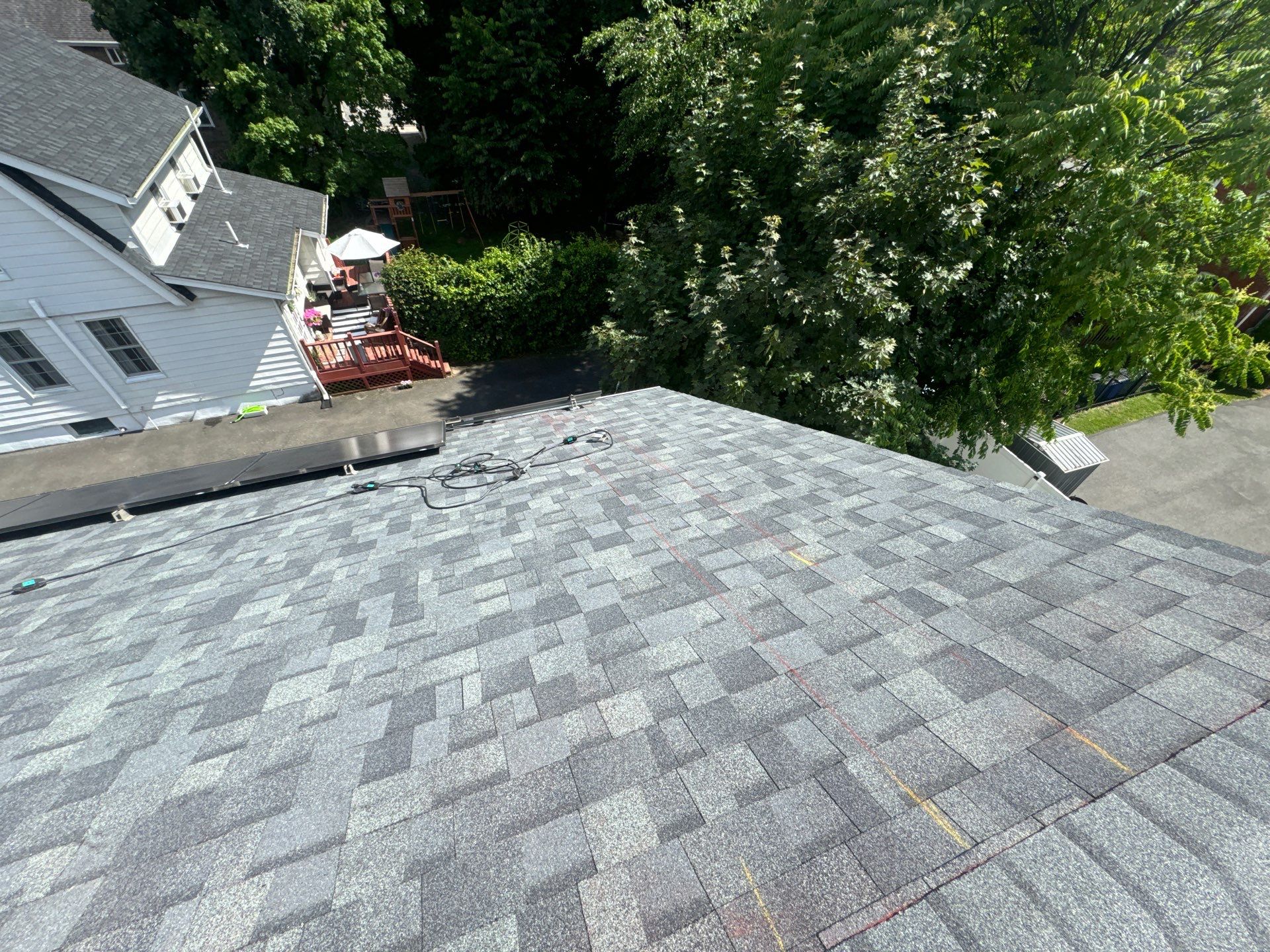 Charcoal Shingles by Reimagine Roofing