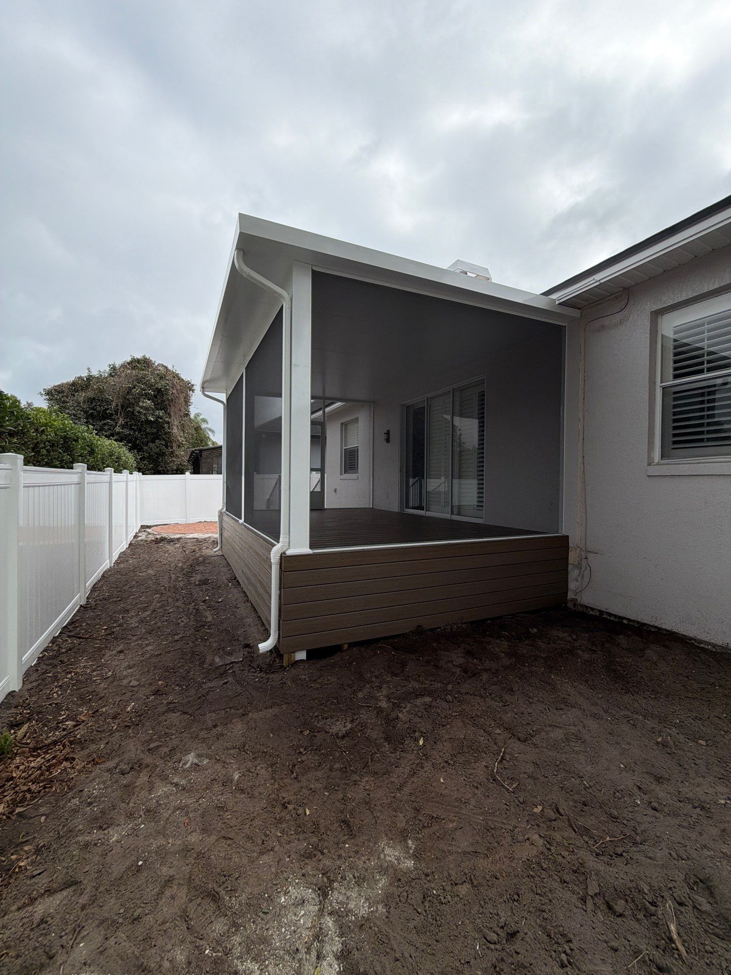 The Complete Backyard Retreat: Insulated Screen Room & Composite Deck by Orlando pergolas