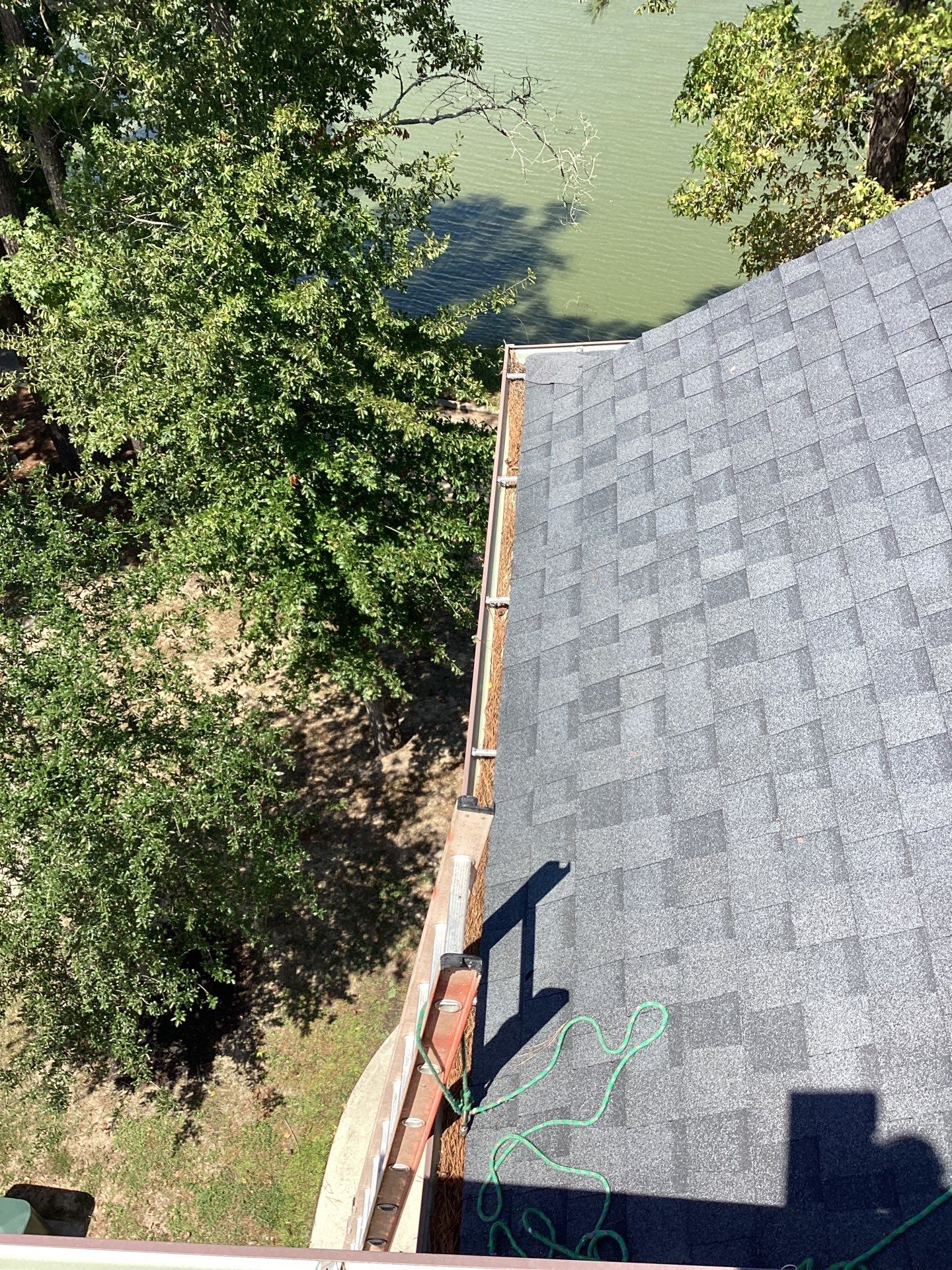 Commercial gutter cleaning Houston before photo with filled gutters