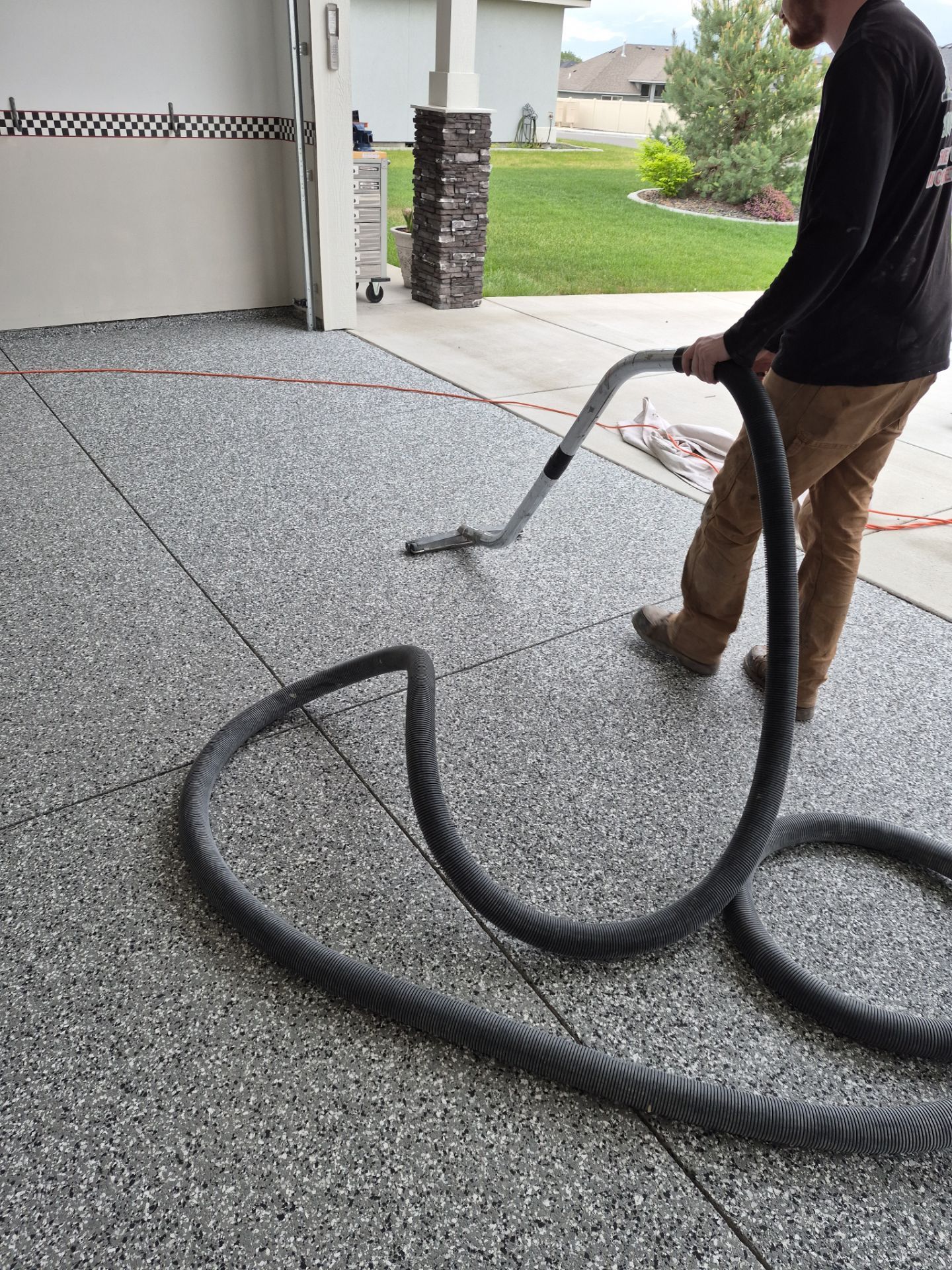 Full Garage Floor Transformation in Smoke 1/4" Flake Finish by Croc Coatings, LLC