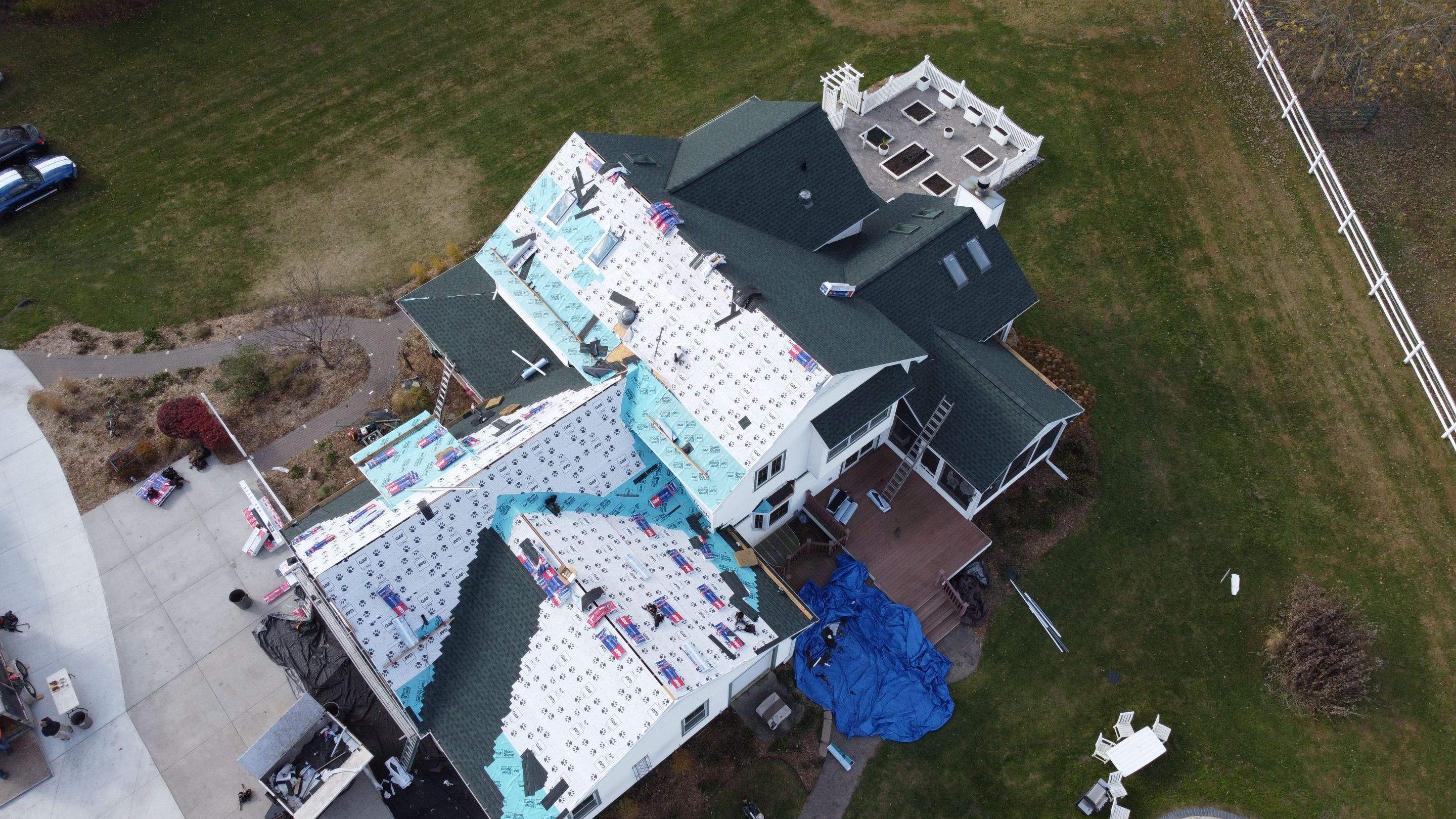 Residential Roofing Replacement with Multiple Skylights in Mason, Michigan by Acme Exteriors