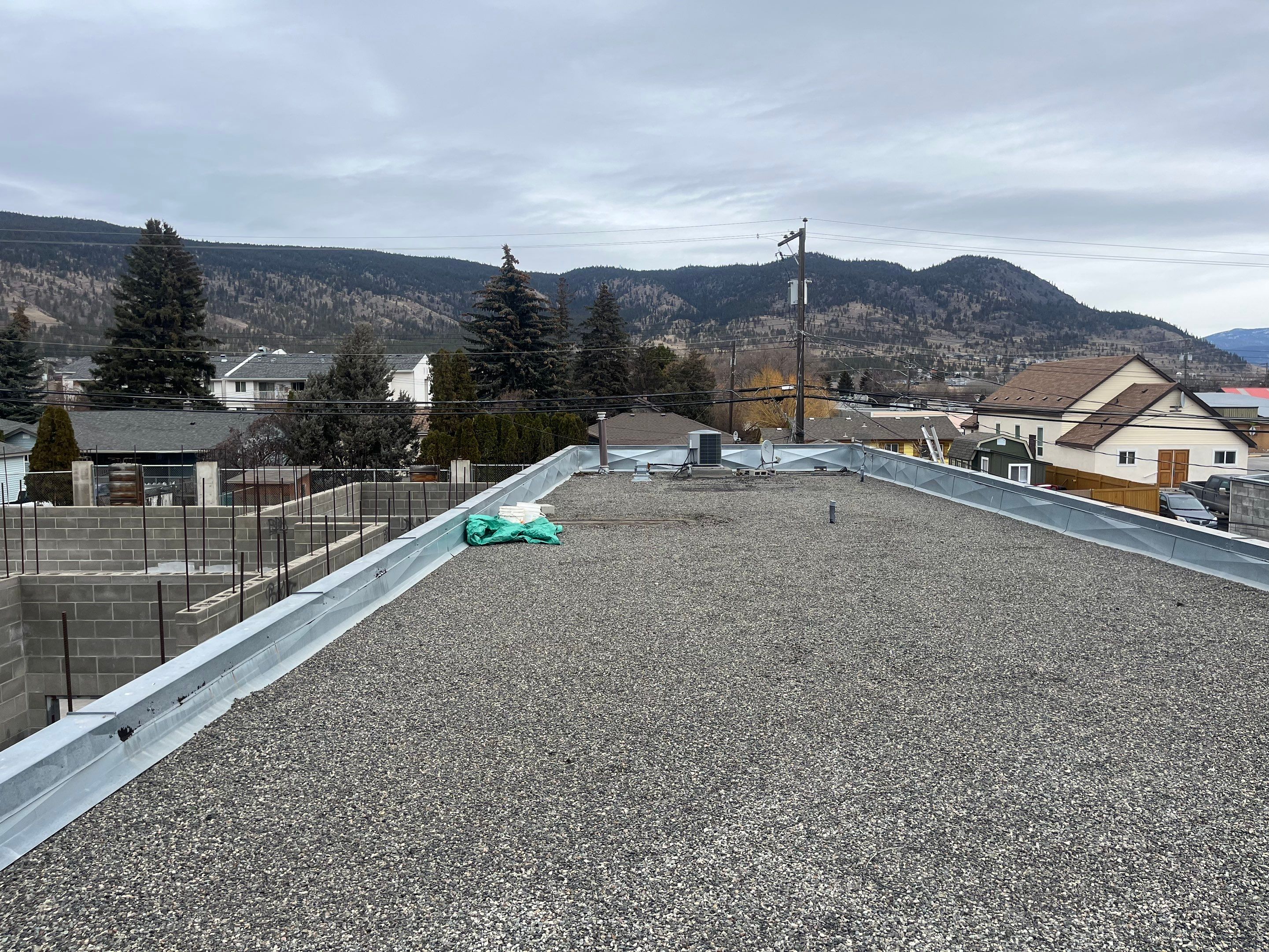 Commercial ReRoofing Installation using IKO 2ply sbs by Top Notch Roofing Inc