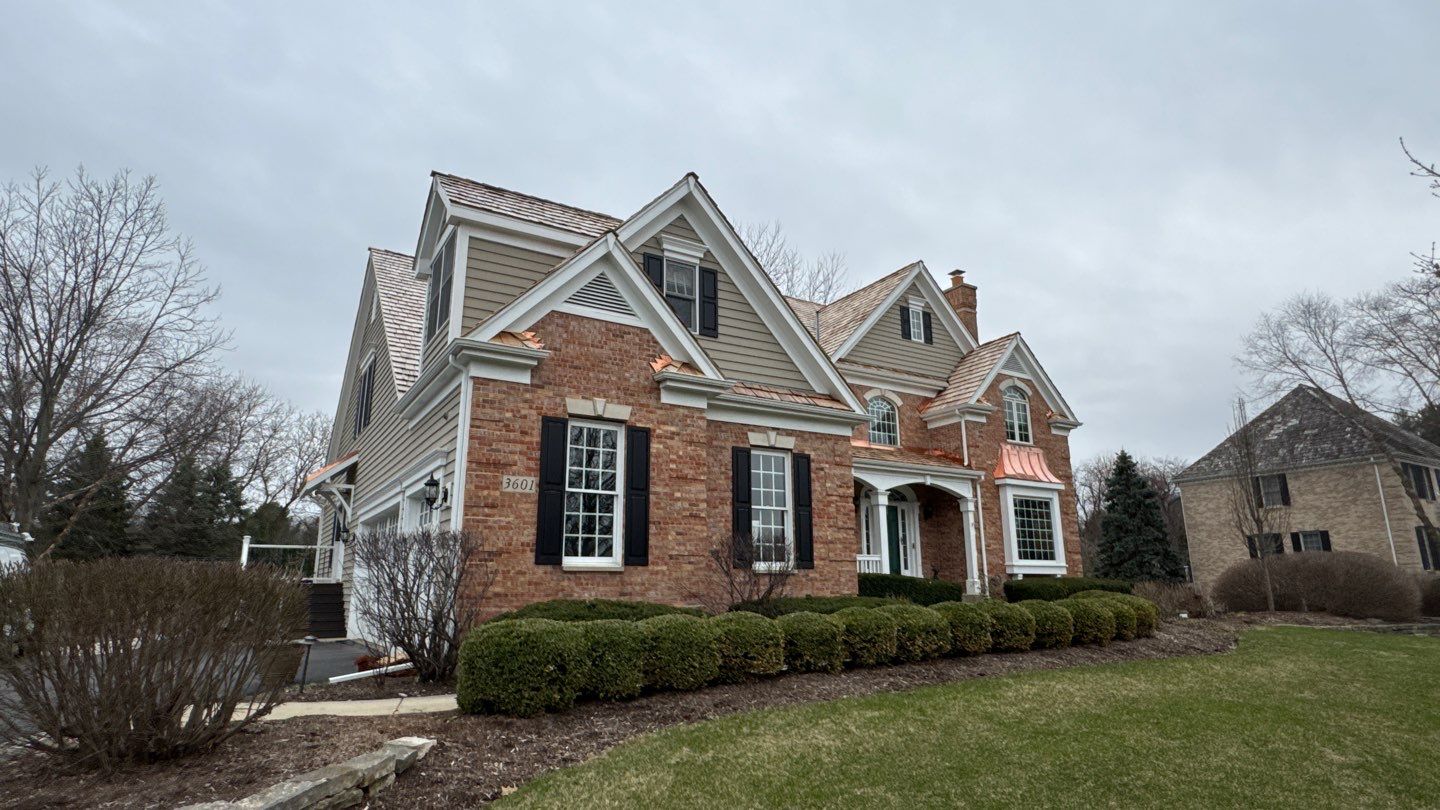 Re-roof: Cedar Shake & Custom Copper by Midwest Building Solutions