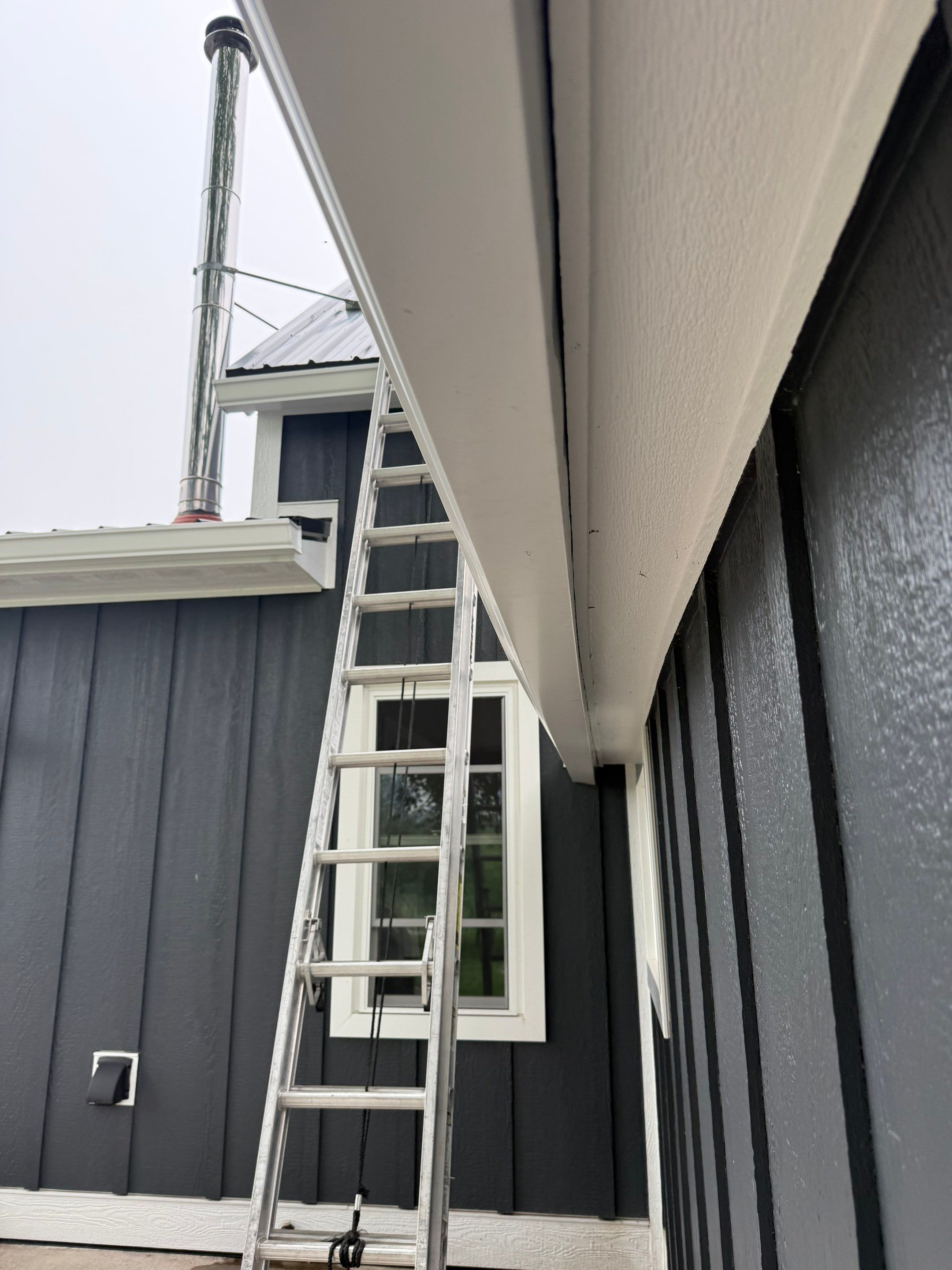 Seamless Gutter and Gutter Helmet Installation on Bellaire Metal Roof by Rainbow Seamless Systems