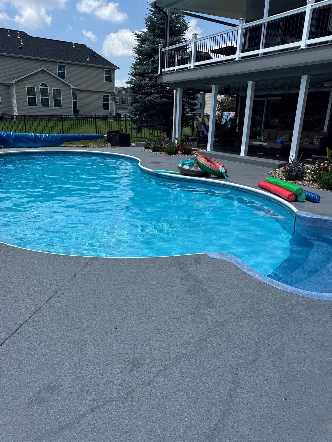 Twilight Pool Deck / Patio Project in Beaver falls by Floors in a Day, Inc