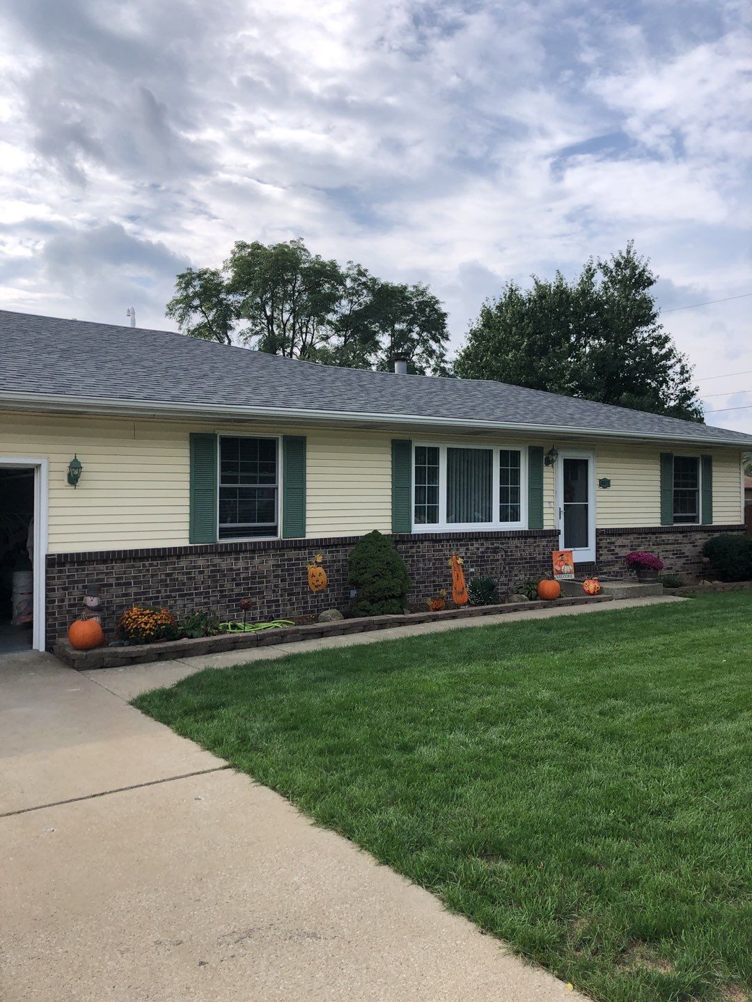taking down brick wall & installing siding by Kraz Construction