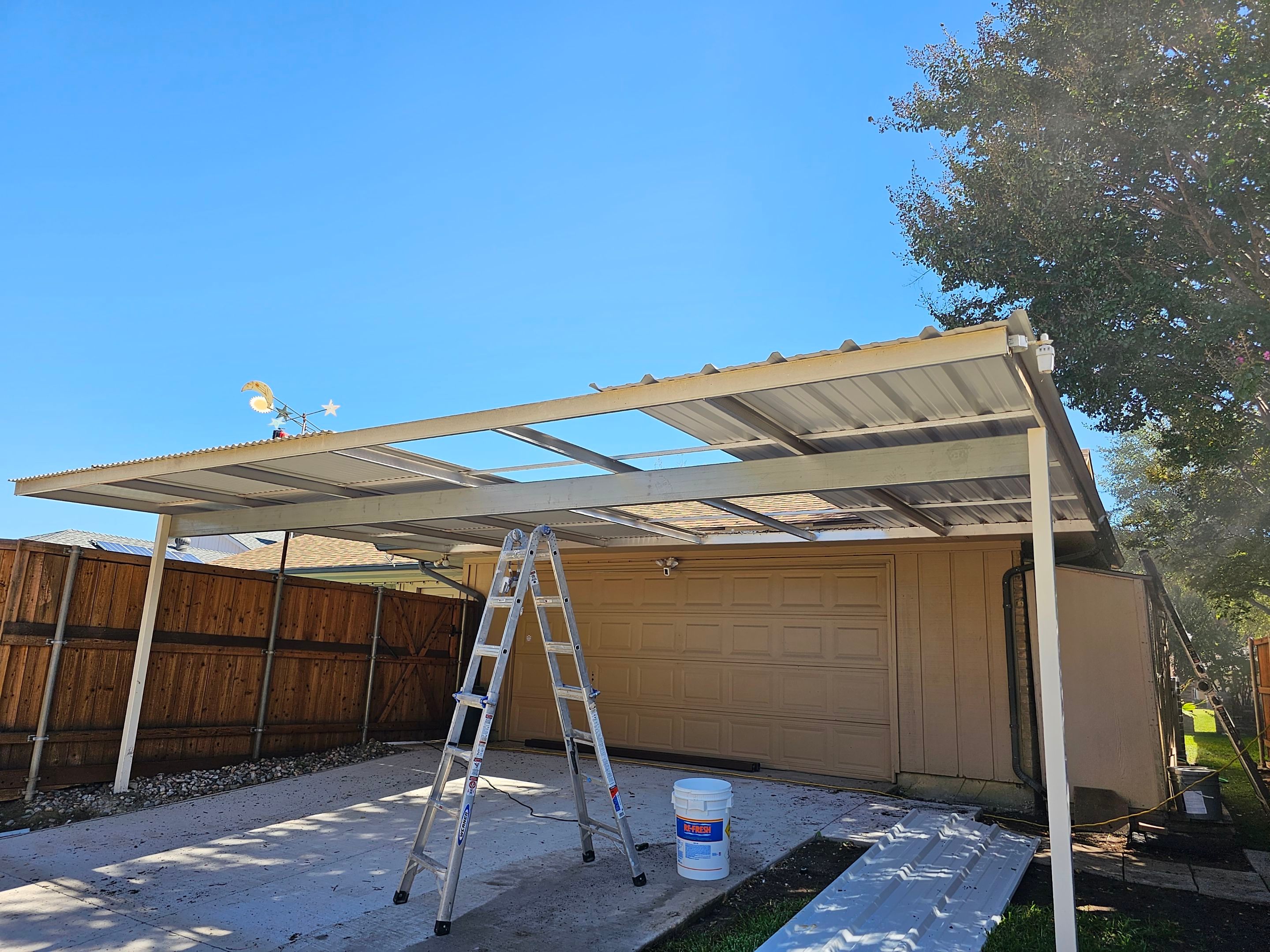 Carport & fence stain by EL-GC LLC 