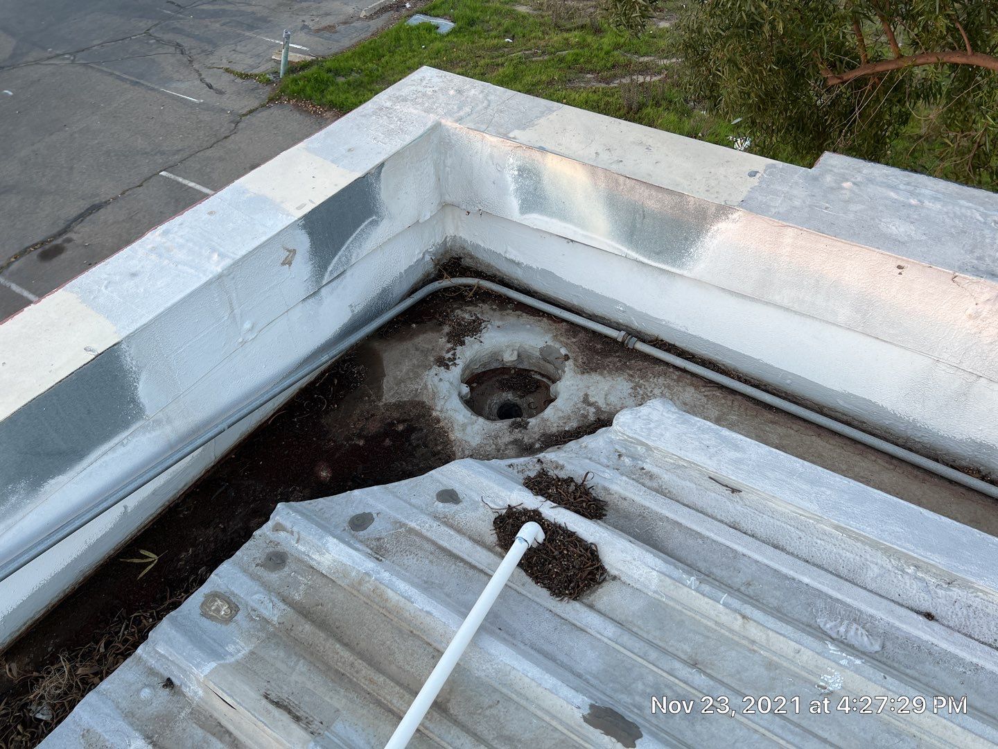 Metal roof restoration on commercial roof using Conklin Benchmark/ PUMA XL acrylic coatings over metal and foam by Straight Edge Roofing Inc