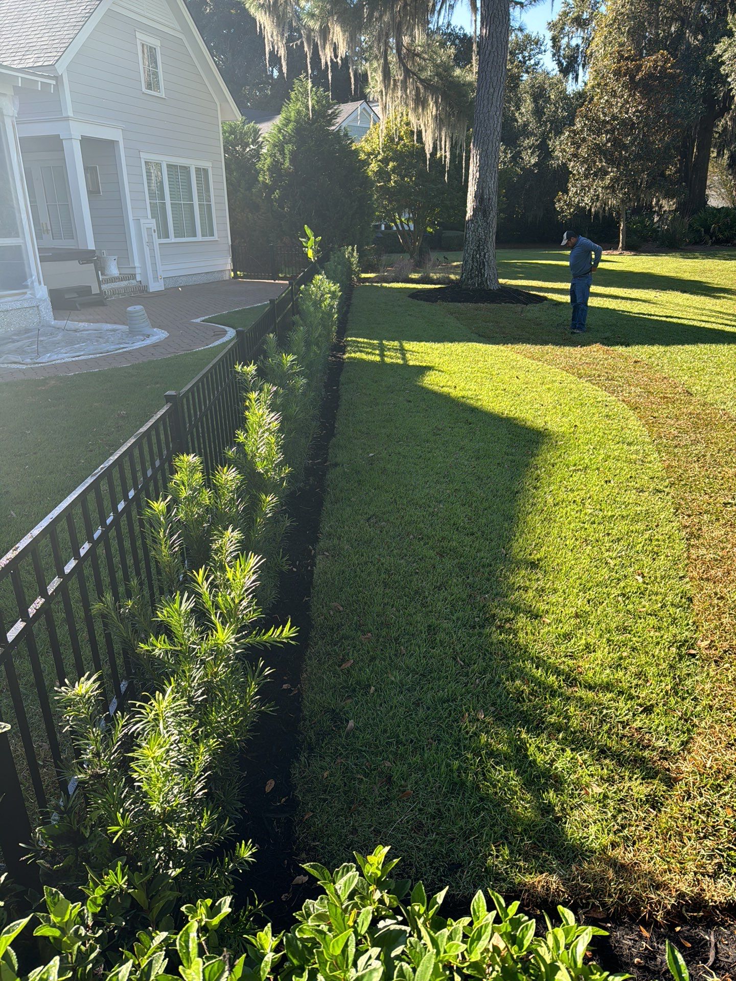 Herringbone Brick Paver Driveway and Custom Landscape Installation in Bluffton by Lowcountry Scapes, LLC