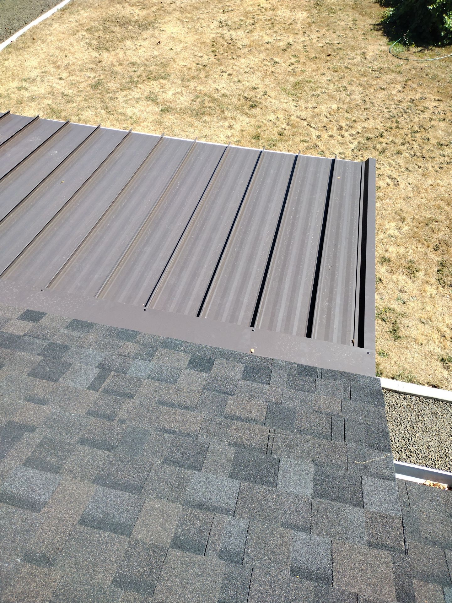 Residential Roof Replacement with Metal Accents by Orezona Building & Roofing Company, Inc.