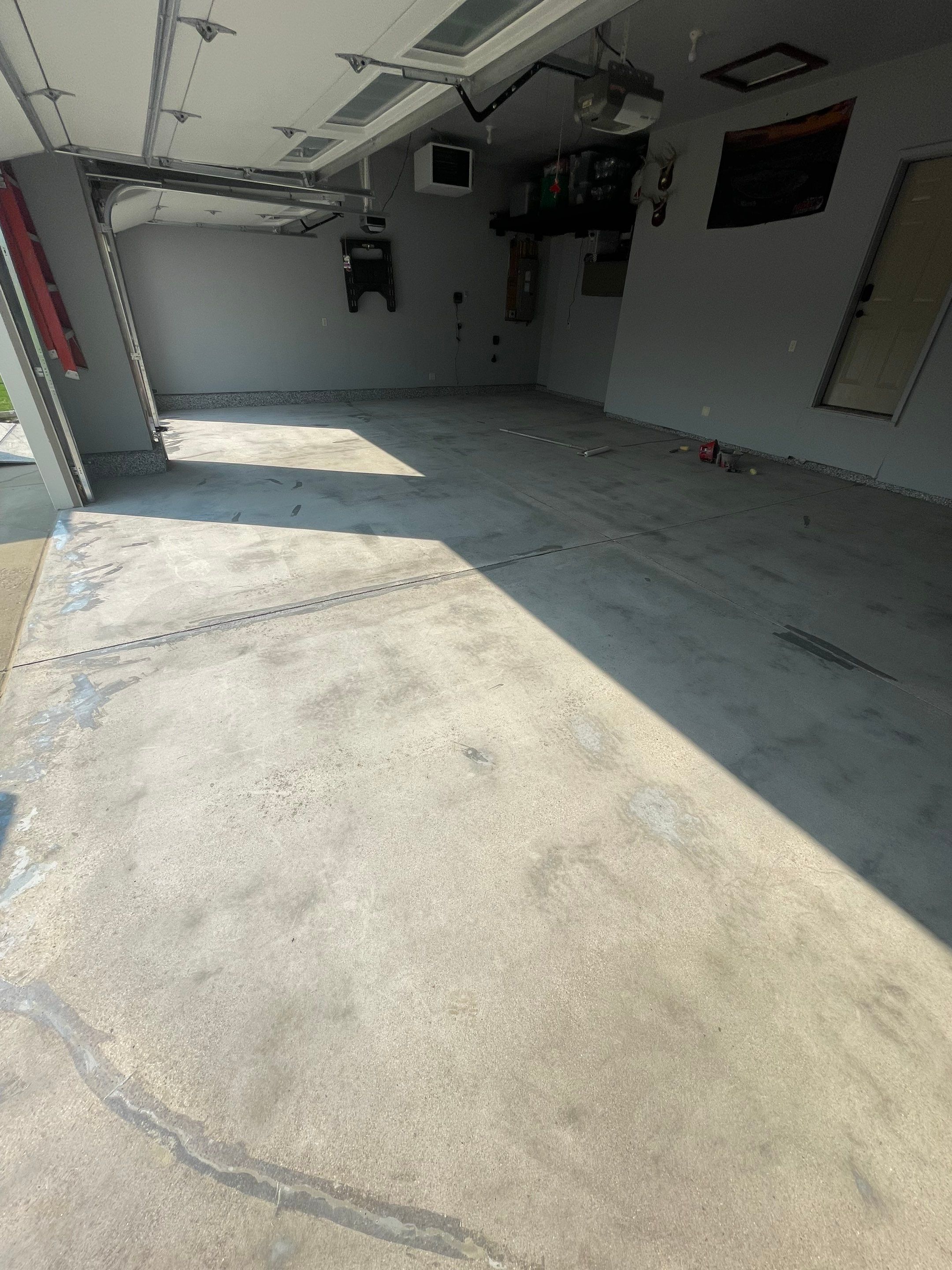 Sioux Falls Garage Concrete Coating Installation with Domino Flake by Select Painting, Coatings & Garage Cabinets