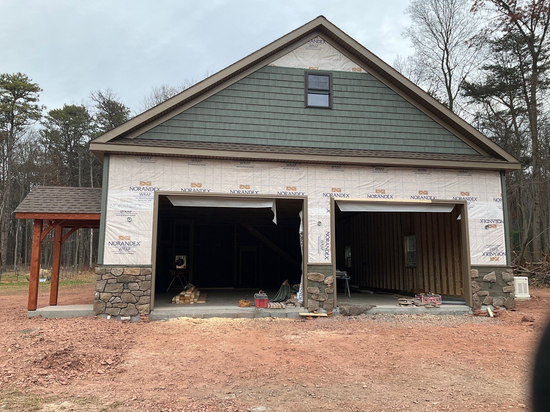 Custom Two-Story Garage with Finished Upper Leve by Esh Builders