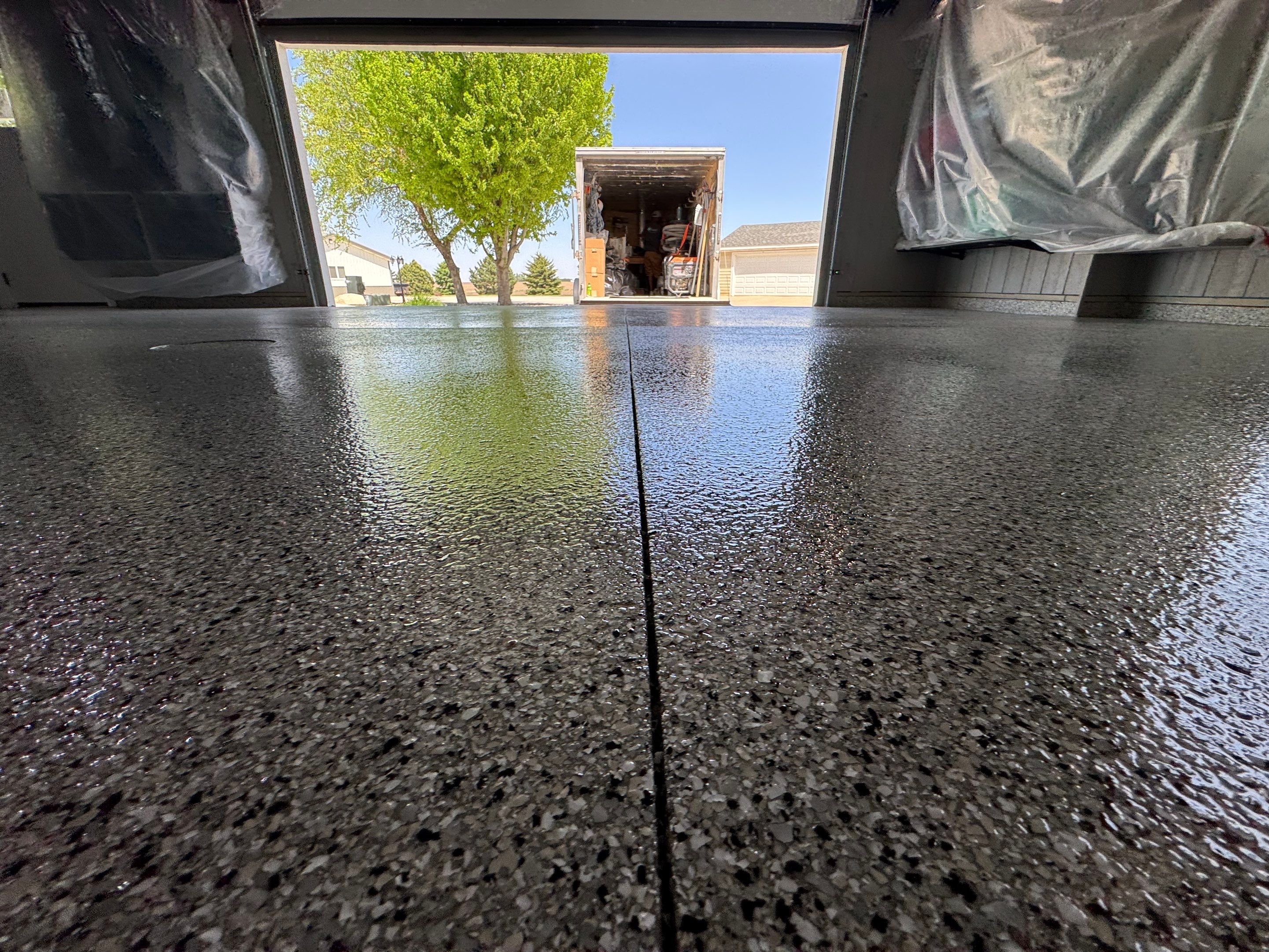 High-Gloss Grey Epoxy Floor Coating for Inwood Garage by Select Painting, Coatings & Garage Cabinets