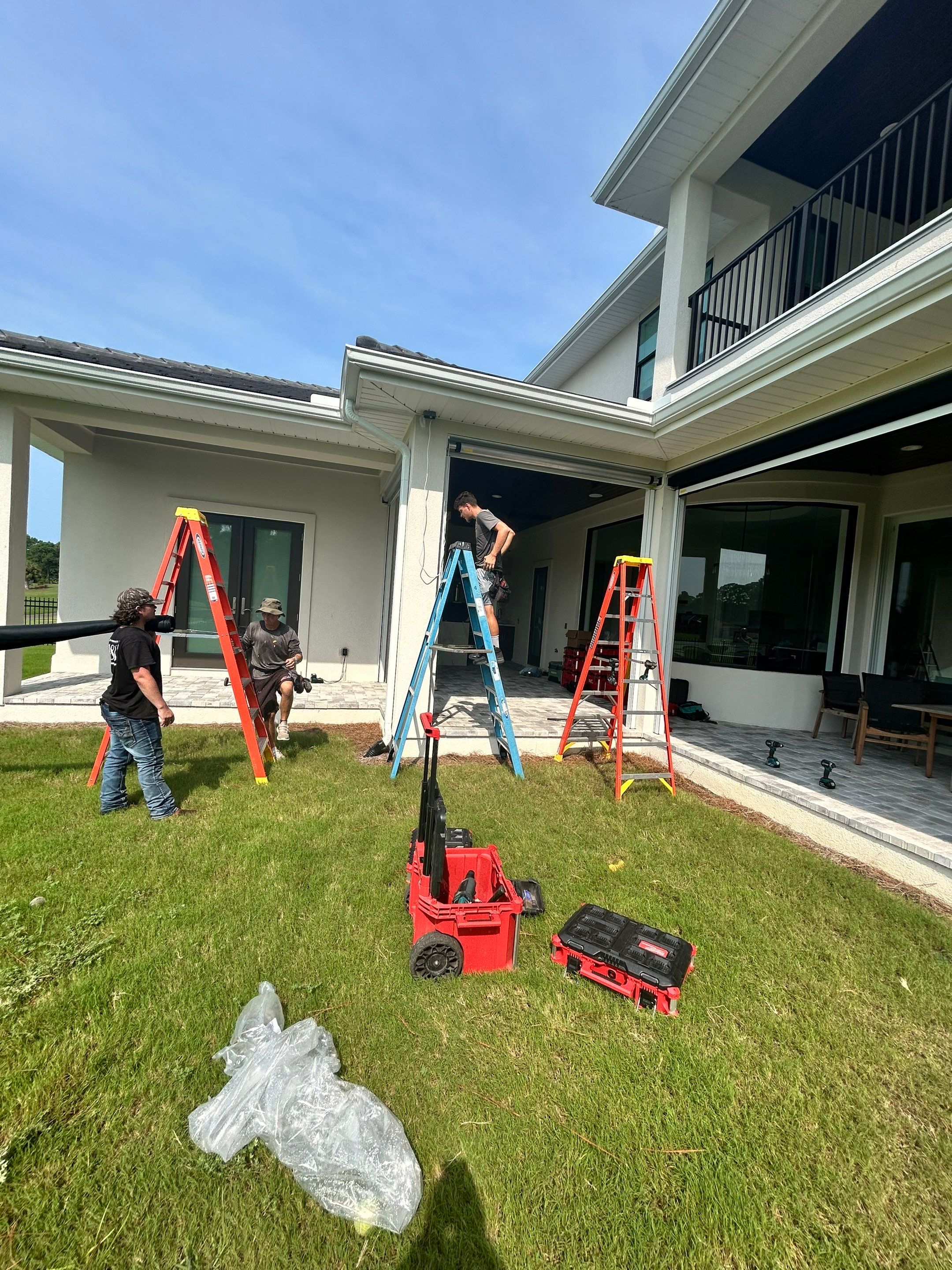Motorized Screen and Solar Shade Installation in Panama City Beach by Brannan Aluminum Inc.