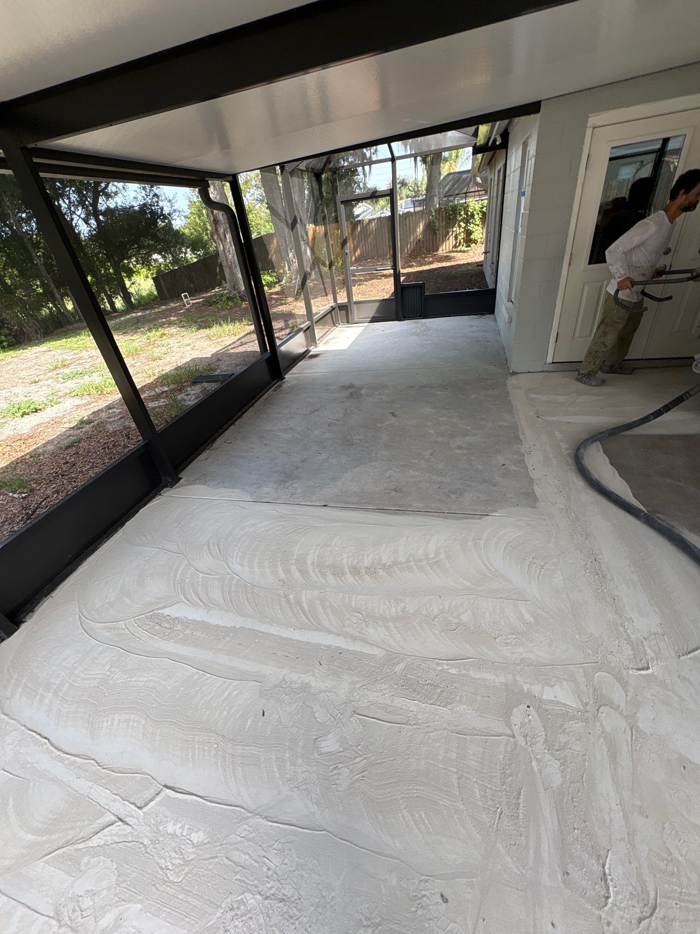 Screened-in Lanai Polyaspartic Floor Coating Installation in Riverview by Performance Floors & Coating