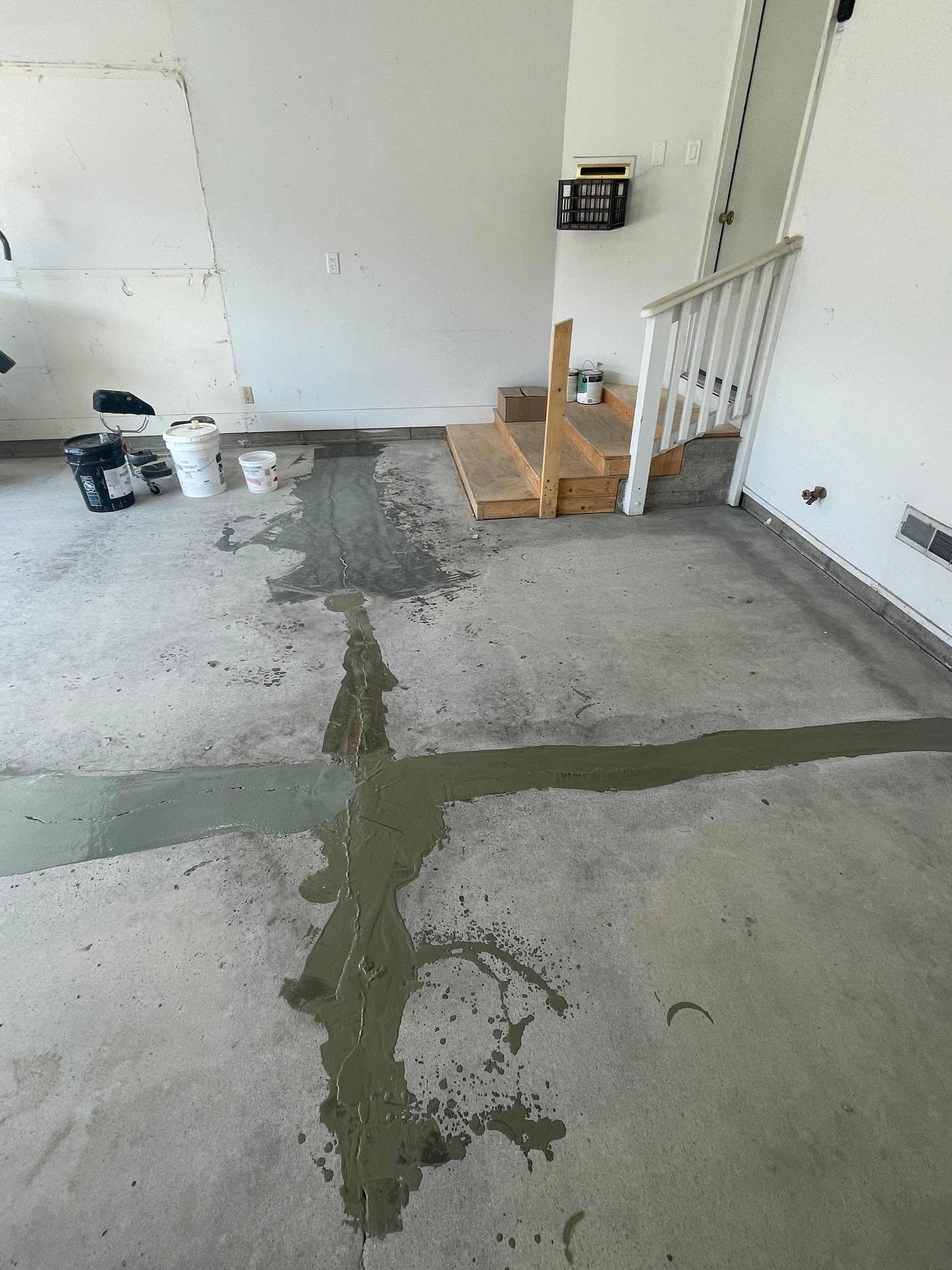 Grey Speckled Concrete Coating for Residential Garage in Yankton by Select Painting, Coatings & Garage Cabinets